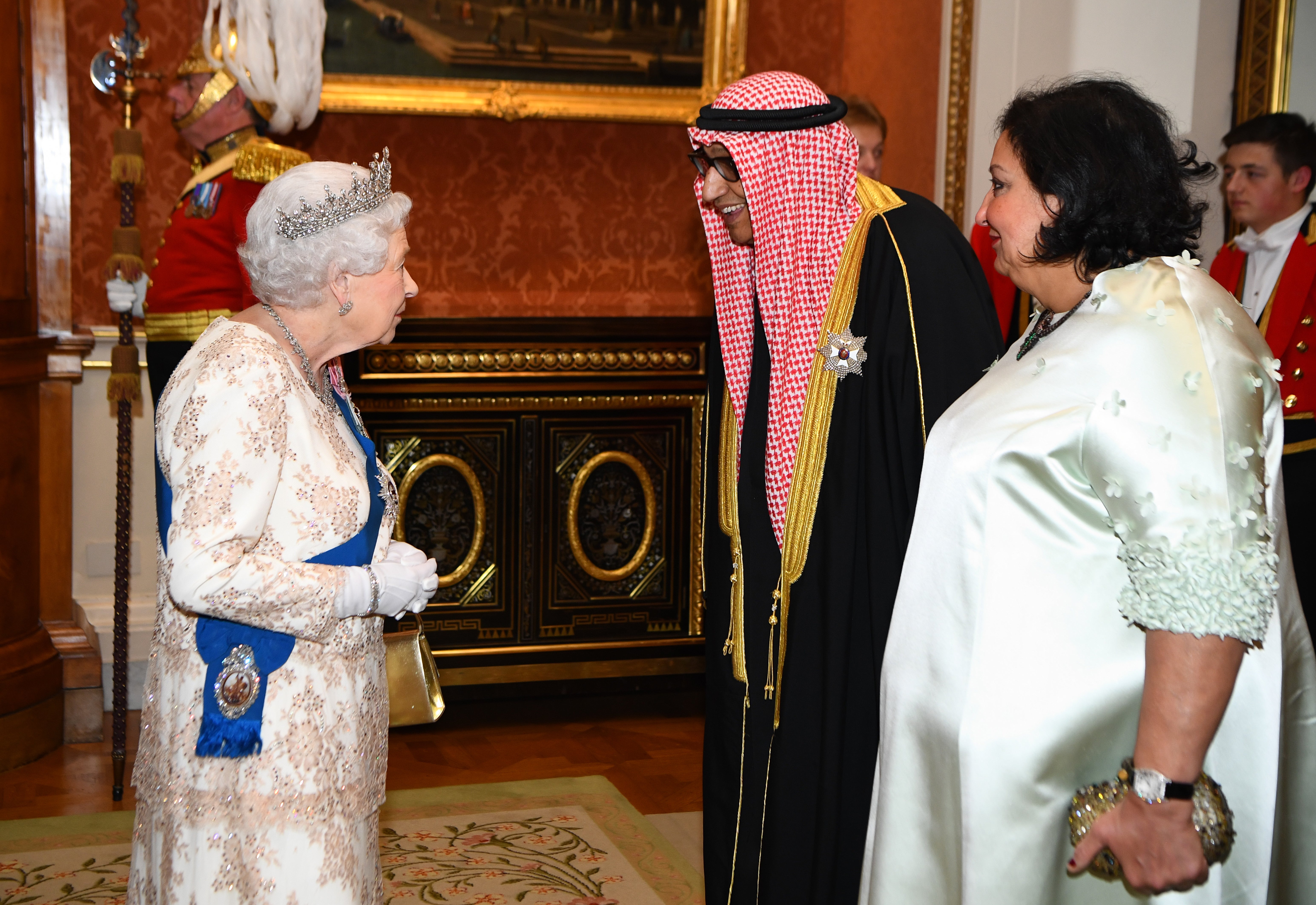 Queen Elizabeth II greets the ambassador of Kuwait at an evening reception for members of the Diplomatic Corps (PA)