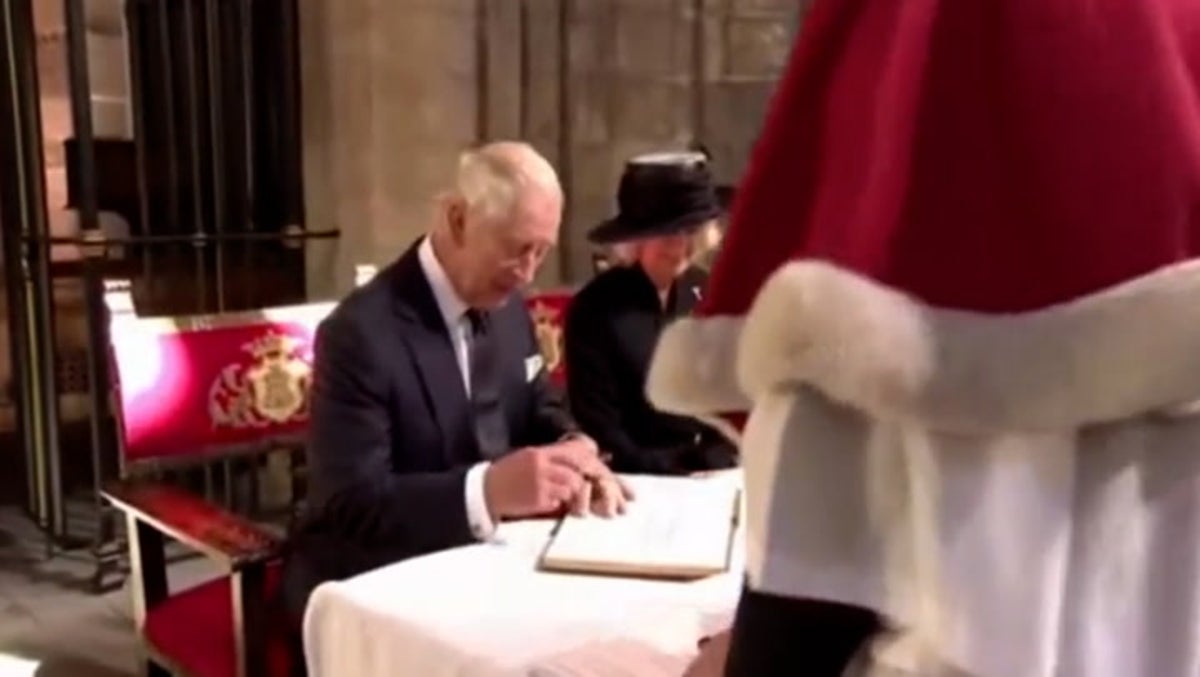 King Charles III signs visitors’ book in Llandaff Cathedral with own fountain pen