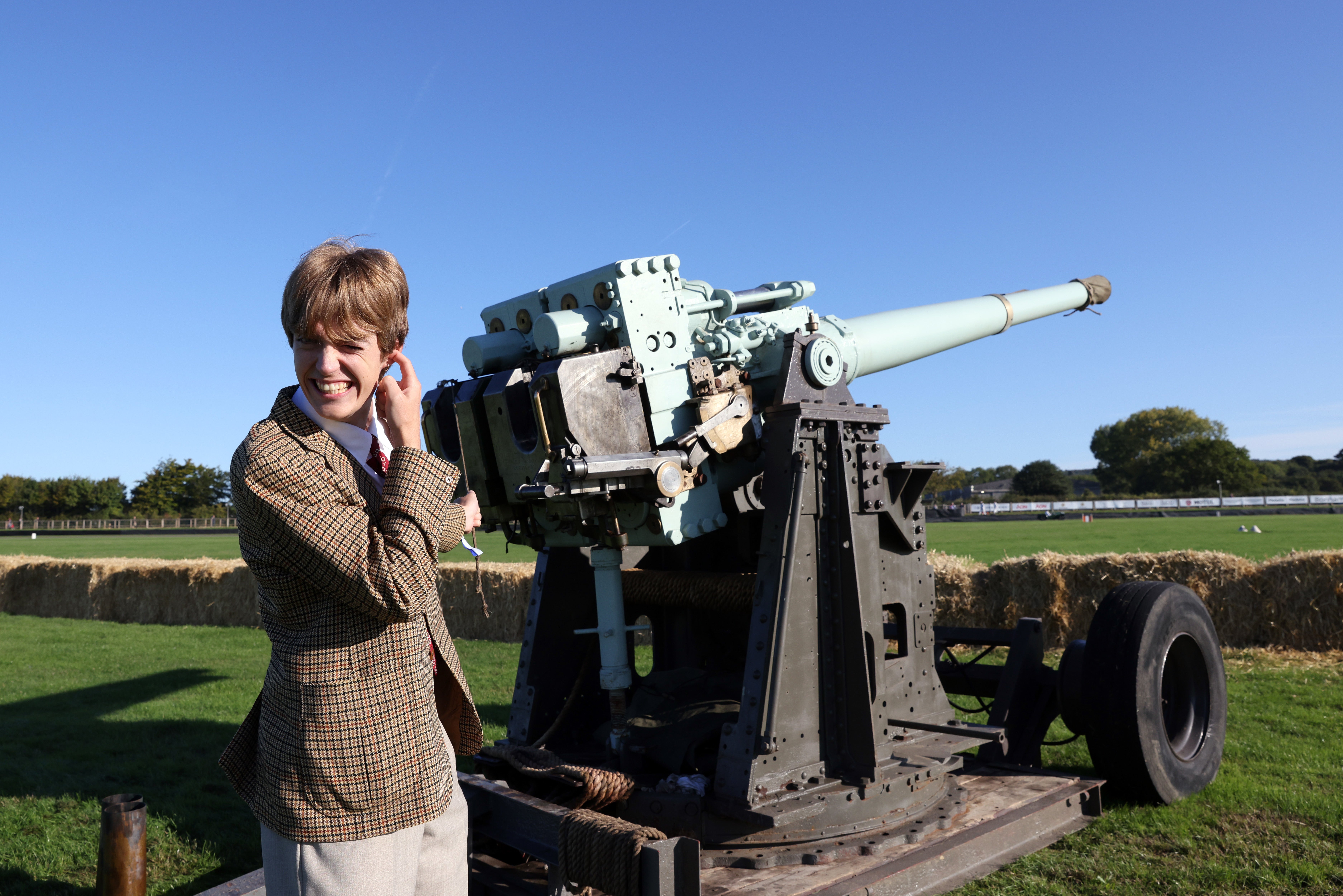 Social media personality Francois Bourgeois fires a naval gun to signal the start of the day’s events (Matt Alexander/PA)