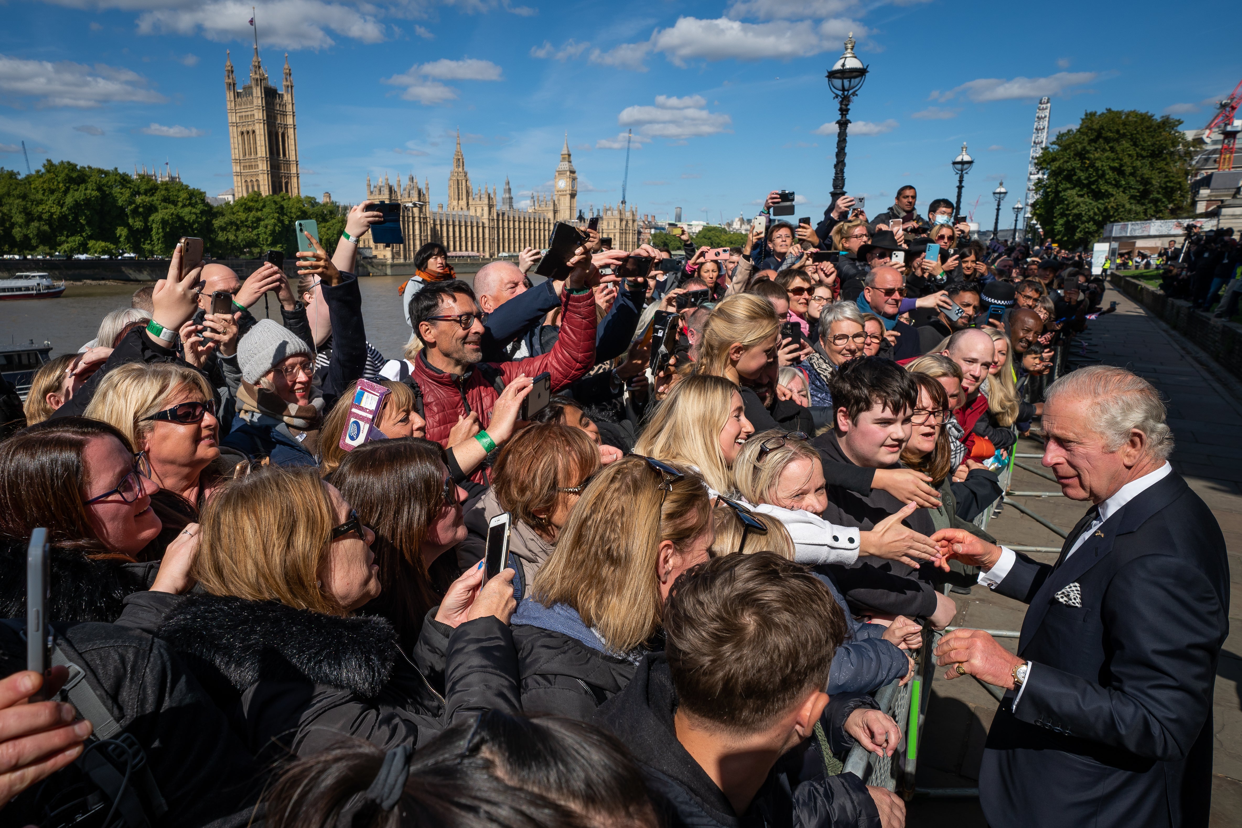 Mourners reach to shake the hand of King Charles (Aaron Chown/PA)