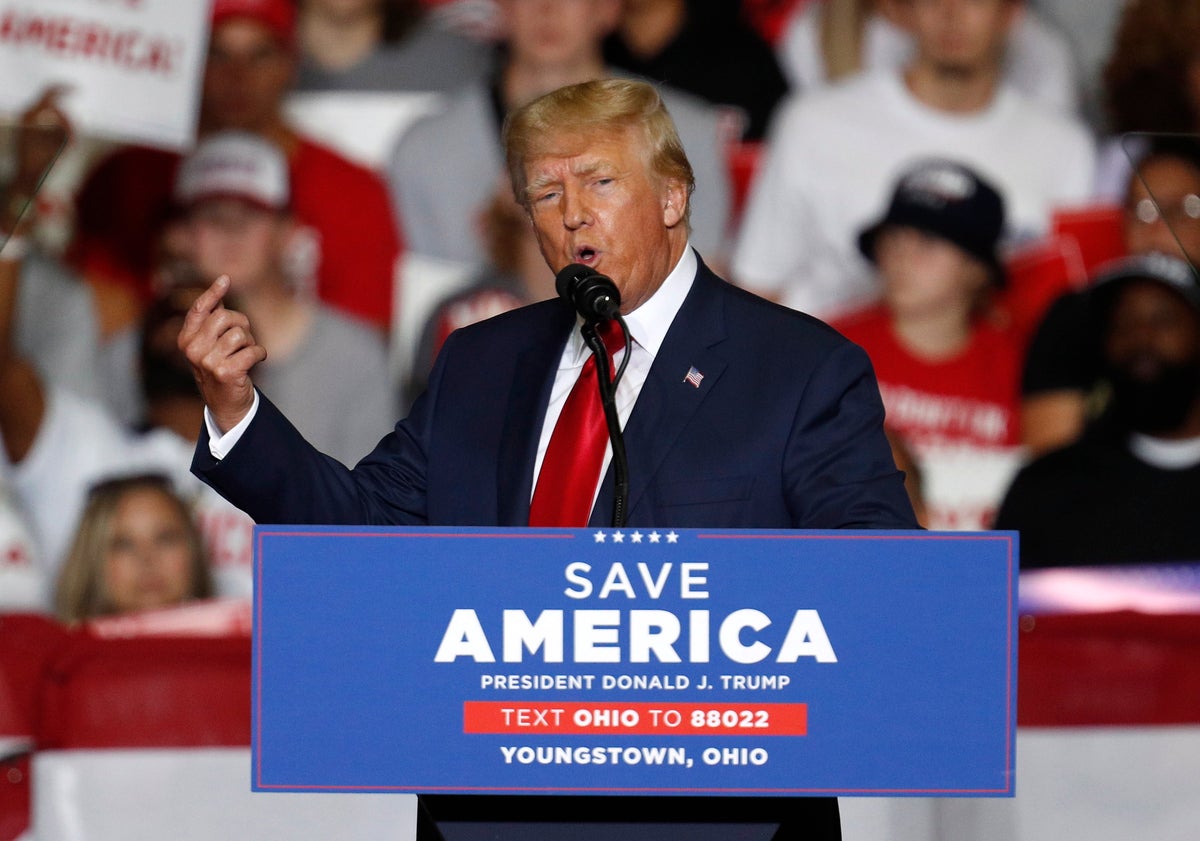 Trump news – live: Trump under fire for QAnon display at Ohio rally