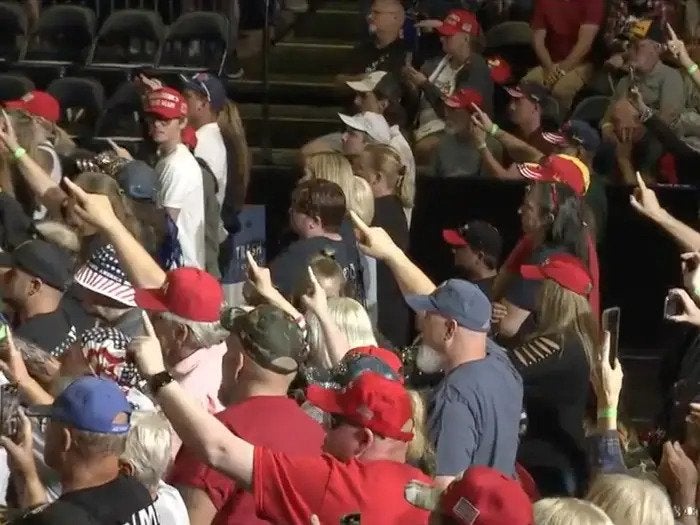 Trump fans a give one-fingered salute at a Trump rally in Youngstown, Ohio