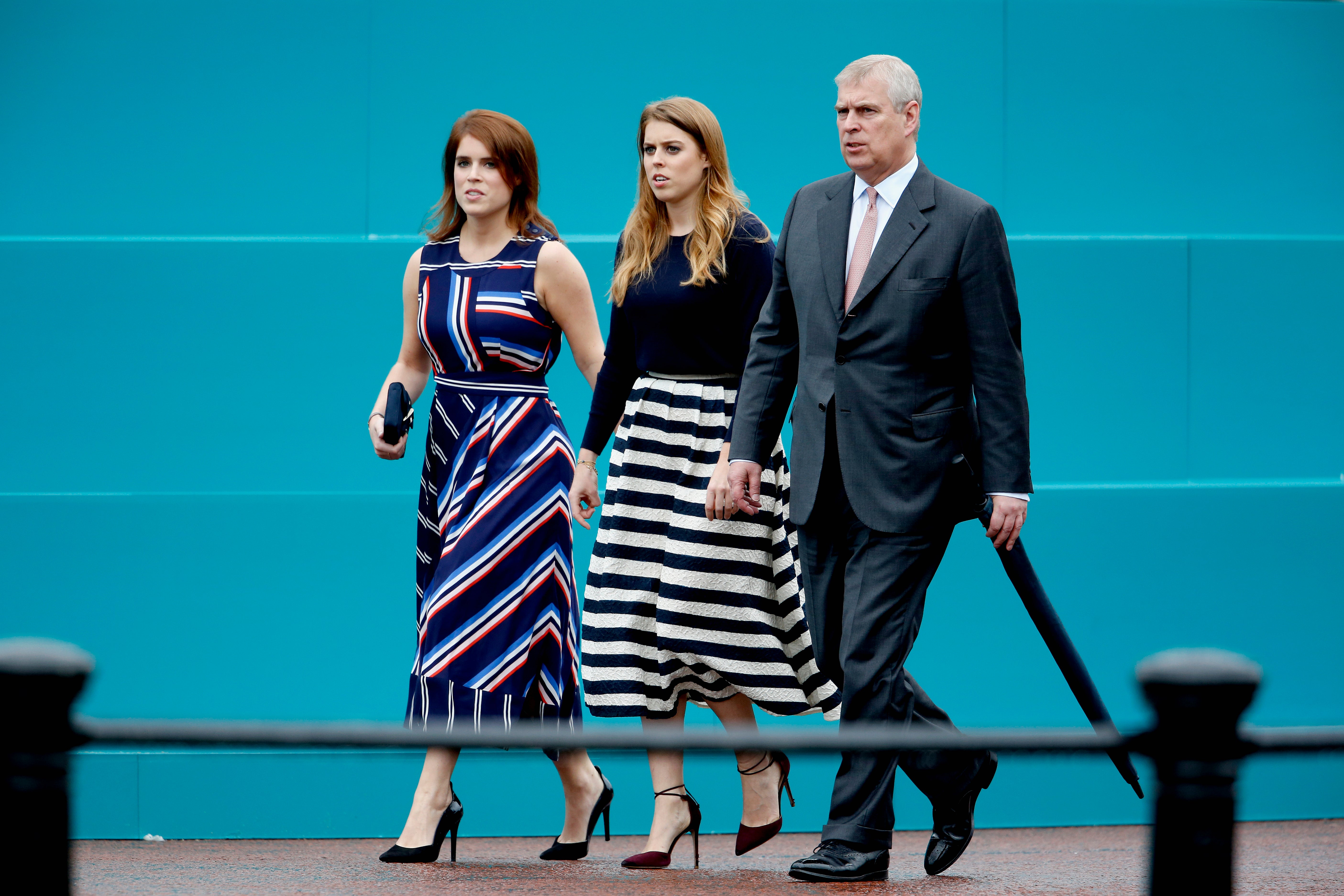 Princess Eugenie of York, Princess Beatrice of York and Prince Andrew, Duke of York walk about during "The Patron's Lunch" celebrations for The Queen's 90th birthday