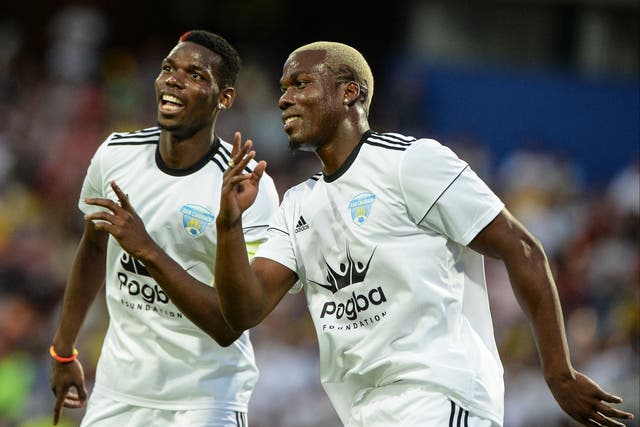 <p>Mathias Pogba (right) has been detained by police over claims he was part of a gang who tried to extort millions from his football star brother Paul Pogba</p>