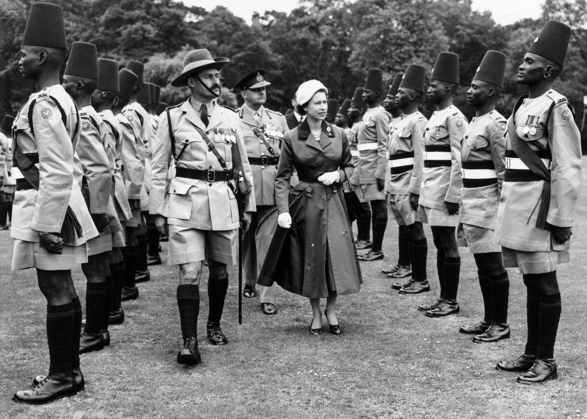 Queen Elizabeth II conducts an inspection of the Kings African Rifles Regiment in the courtyard of Buckingham Palace in London, Britain, 11 June 1957