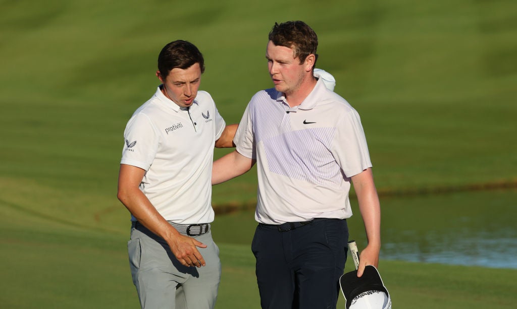 Matthew Fitzpatrick embraces Robert MacIntyre on the 18th green after their play-off