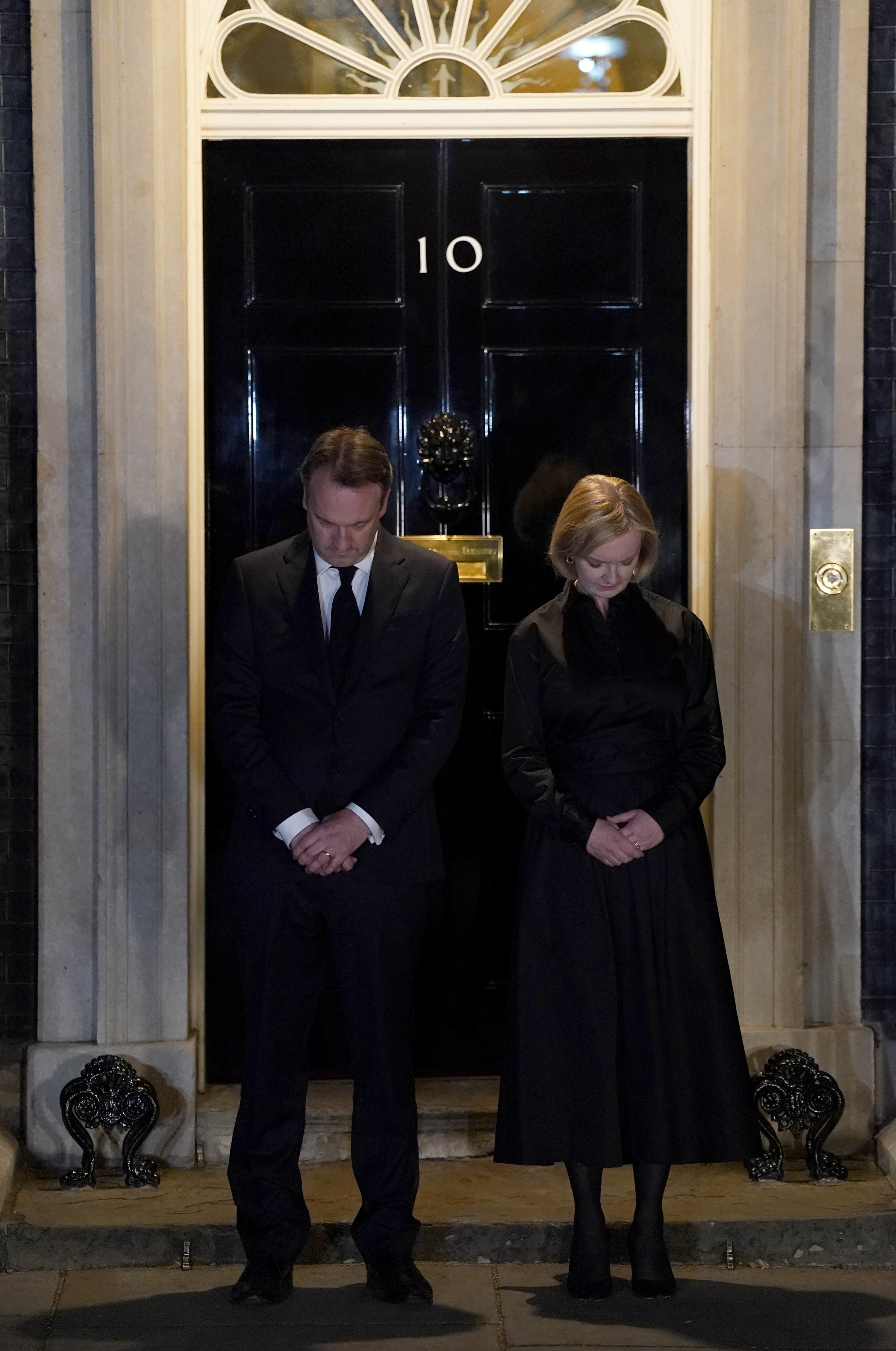 Prime Minister Liz Truss and her husband Hugh O’Leary observe the national minute’s silence (Jacob King/PA)