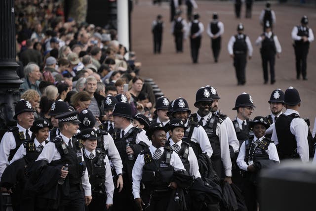 Police officers ahead of the ceremonial procession of the coffin of Queen Elizabeth II from Buckingham Palace to Westminster Hall (Vadim Ghirda/PA)