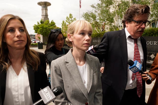 <p>Sherri Papini of Redding walks to the federal courthouse accompanied by her attorney, William Portanova, right, in Sacramento, Calif., Wednesday, April 13, 2022</p>