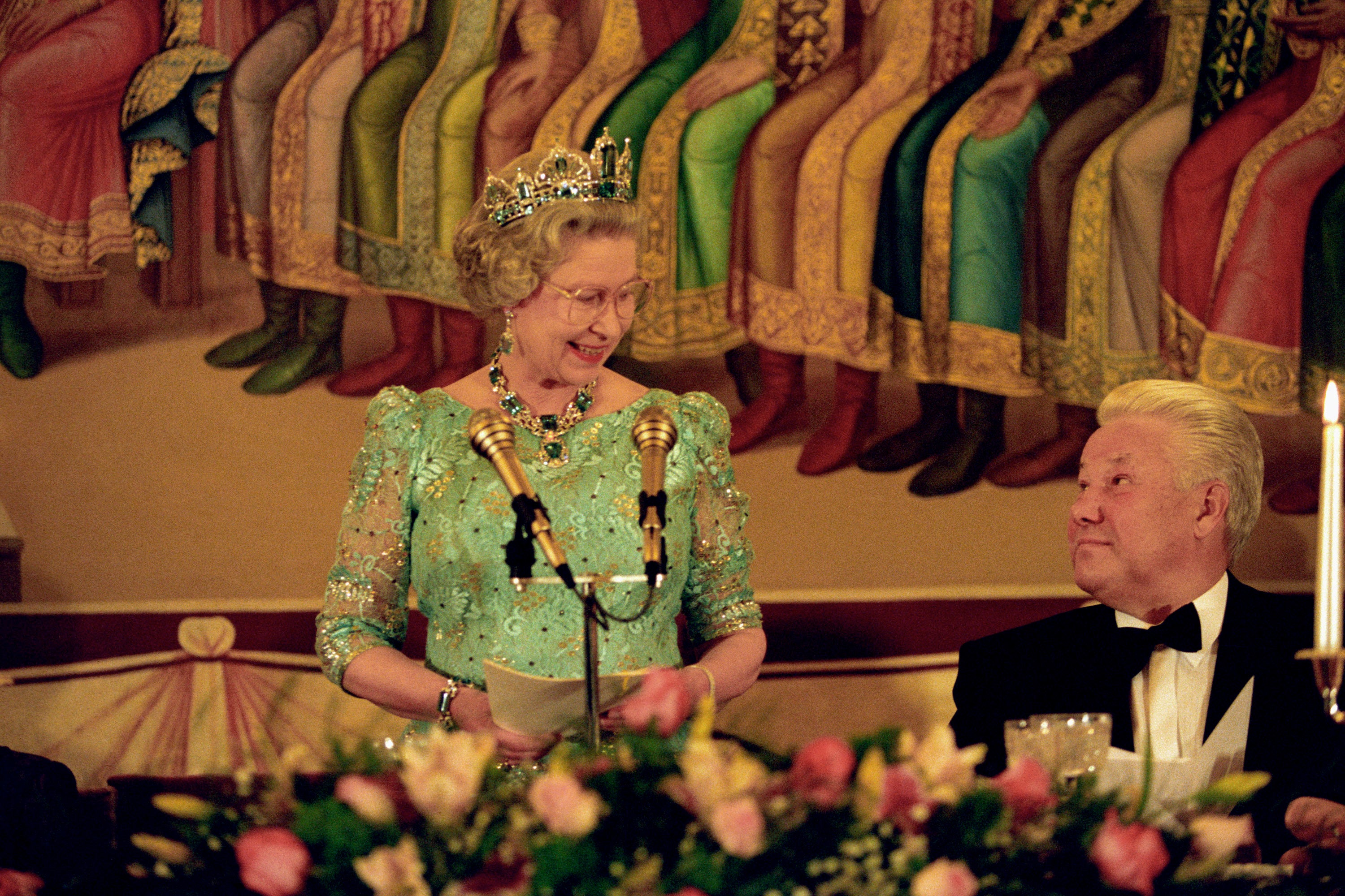 The Queen and Boris Yeltsin exchange a smile as the Queen makes a speech during a state banquet held in her honour at the Kremlin’s Faceted Hall in 1994 (Martin Keene/PA)
