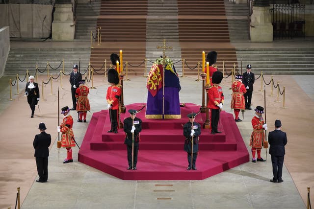 Black Rod walks through Westminster Hall at 6.29am to pay her respects on the final day of the lying in state at the coffin of Queen Elizabeth II, draped in the Royal Standard with the Imperial State Crown and the Sovereign’s orb and sceptre, lying in state on the catafalque in Westminster Hall, at the Palace of Westminster, London (PA)