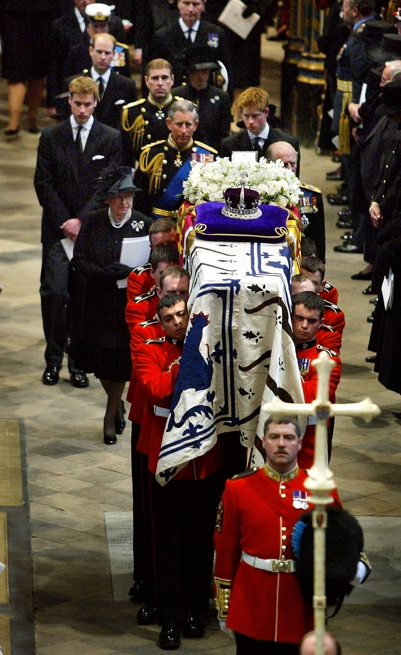 The royal family follows the Queen Mother's coffin out of Westminster Abbey after her funeral service