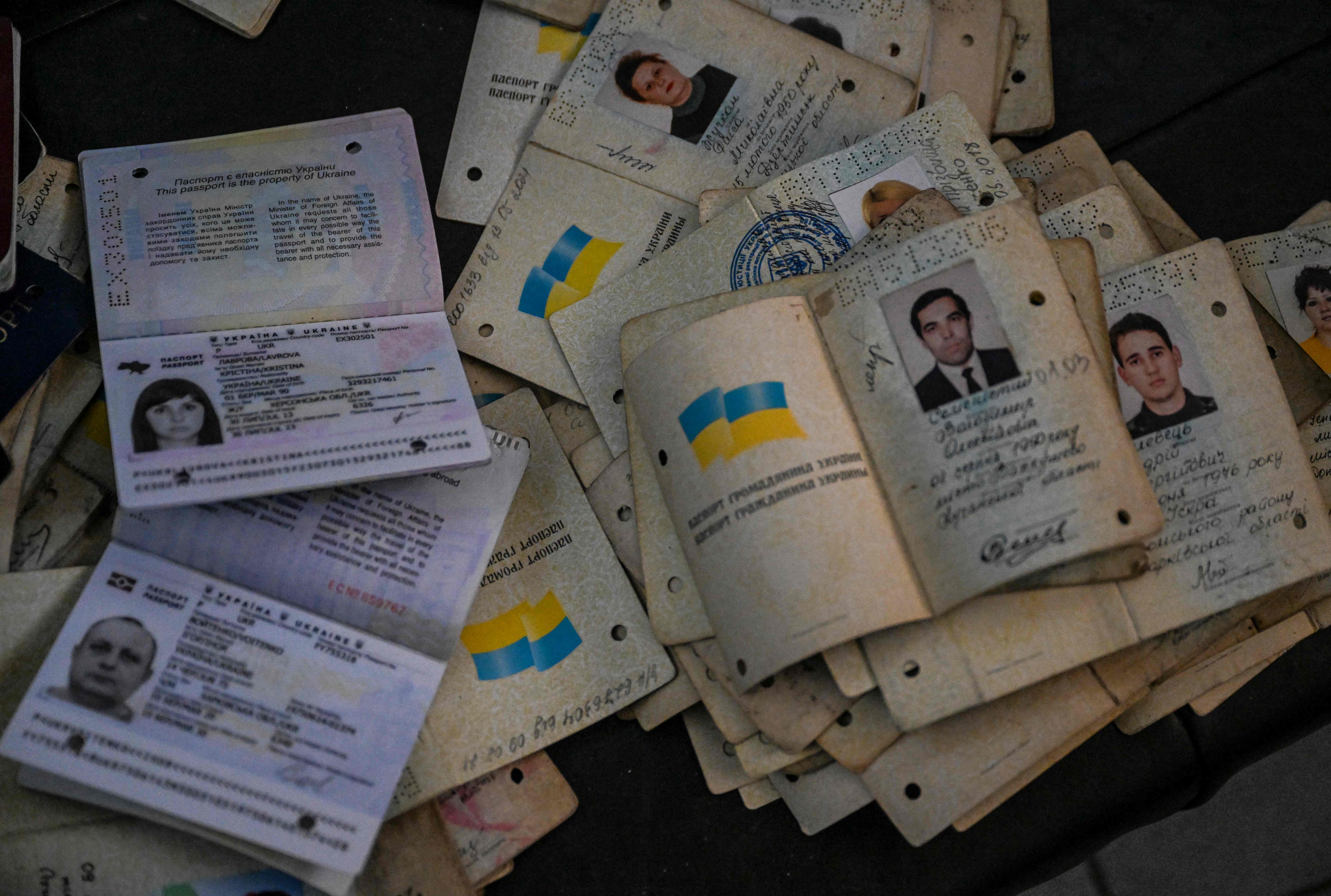 A pile of passport recovered from inside a destroyed police station in Izyum, eastern Ukraine