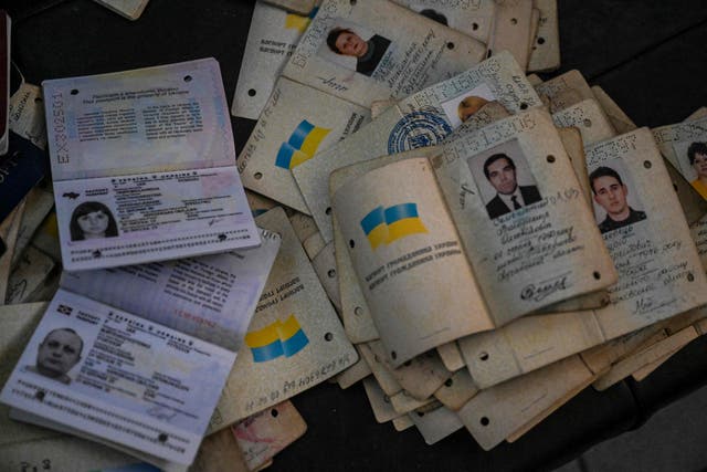 <p>A pile of passport recovered from inside a destroyed police station in Izyum, eastern Ukraine</p>