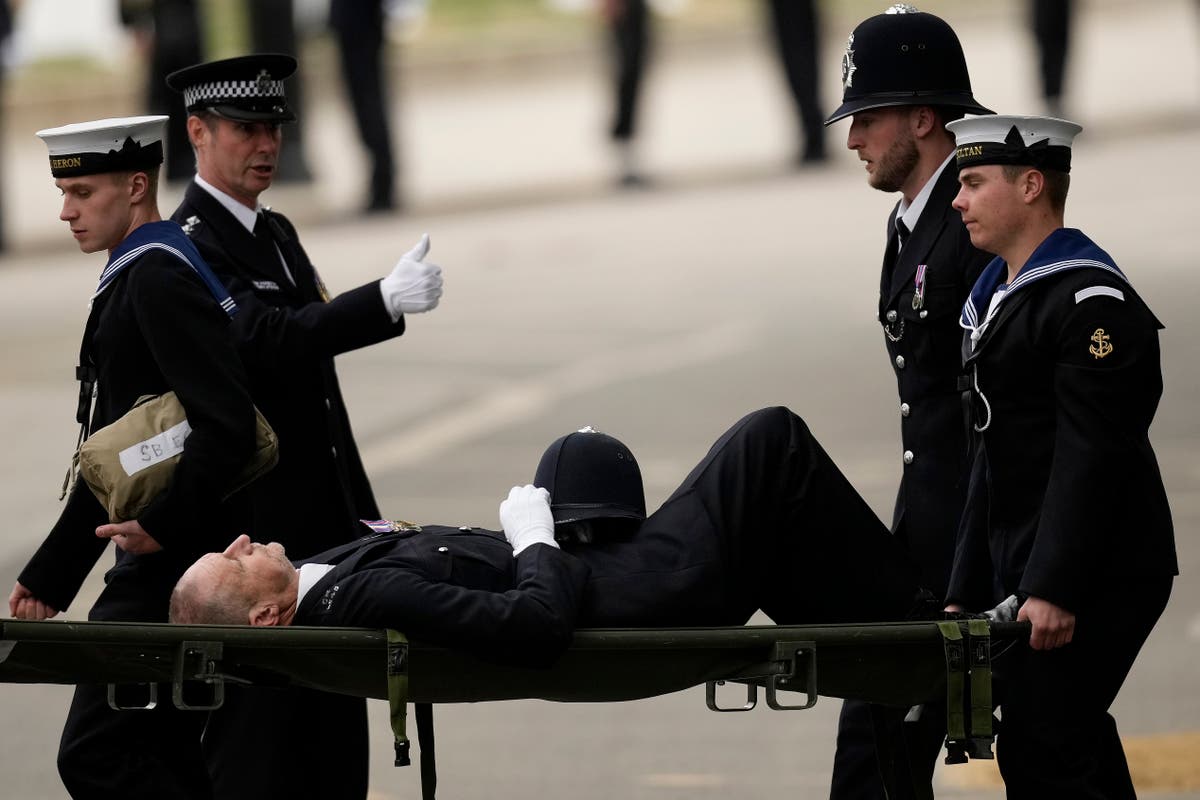 Police officer carried away on stretcher after collapsing before Queen&rsquo;s funeral