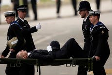 Police officer carried away on stretcher after collapsing before Queen’s funeral
