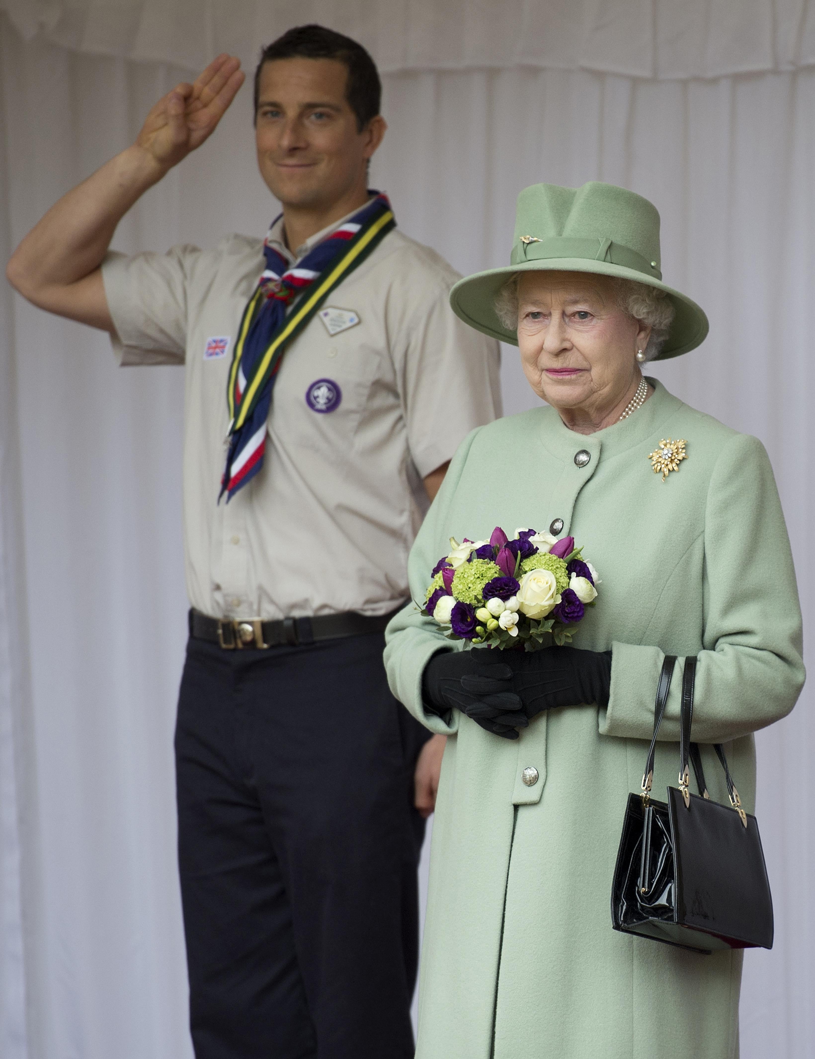 Chief Scout Bear Grylls salutes as the Queen reviews the Queen’s Scouts at Windsor Castle in 2012