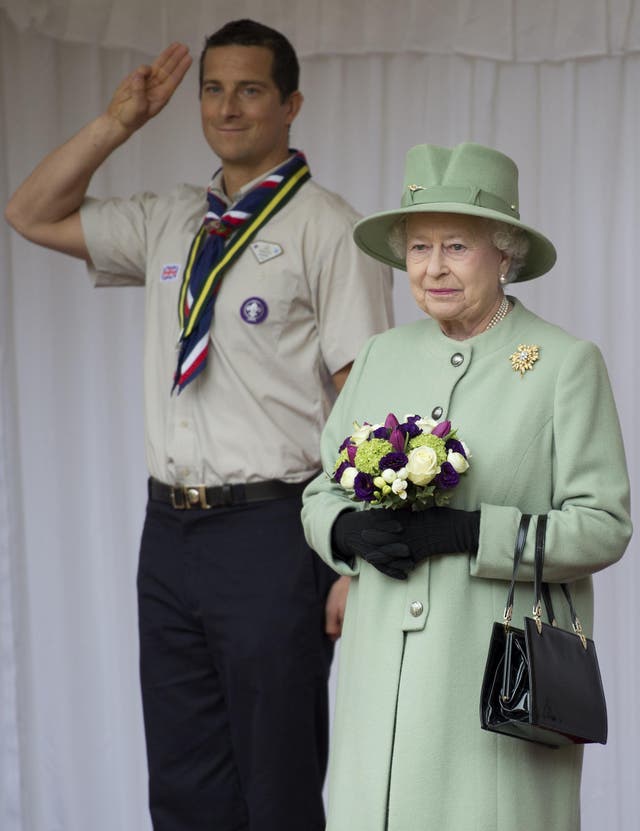 Chief Scout Bear Grylls salutes as the Queen reviews the Queen’s Scouts at Windsor Castle in 2012 (Ben Stansall/PA)