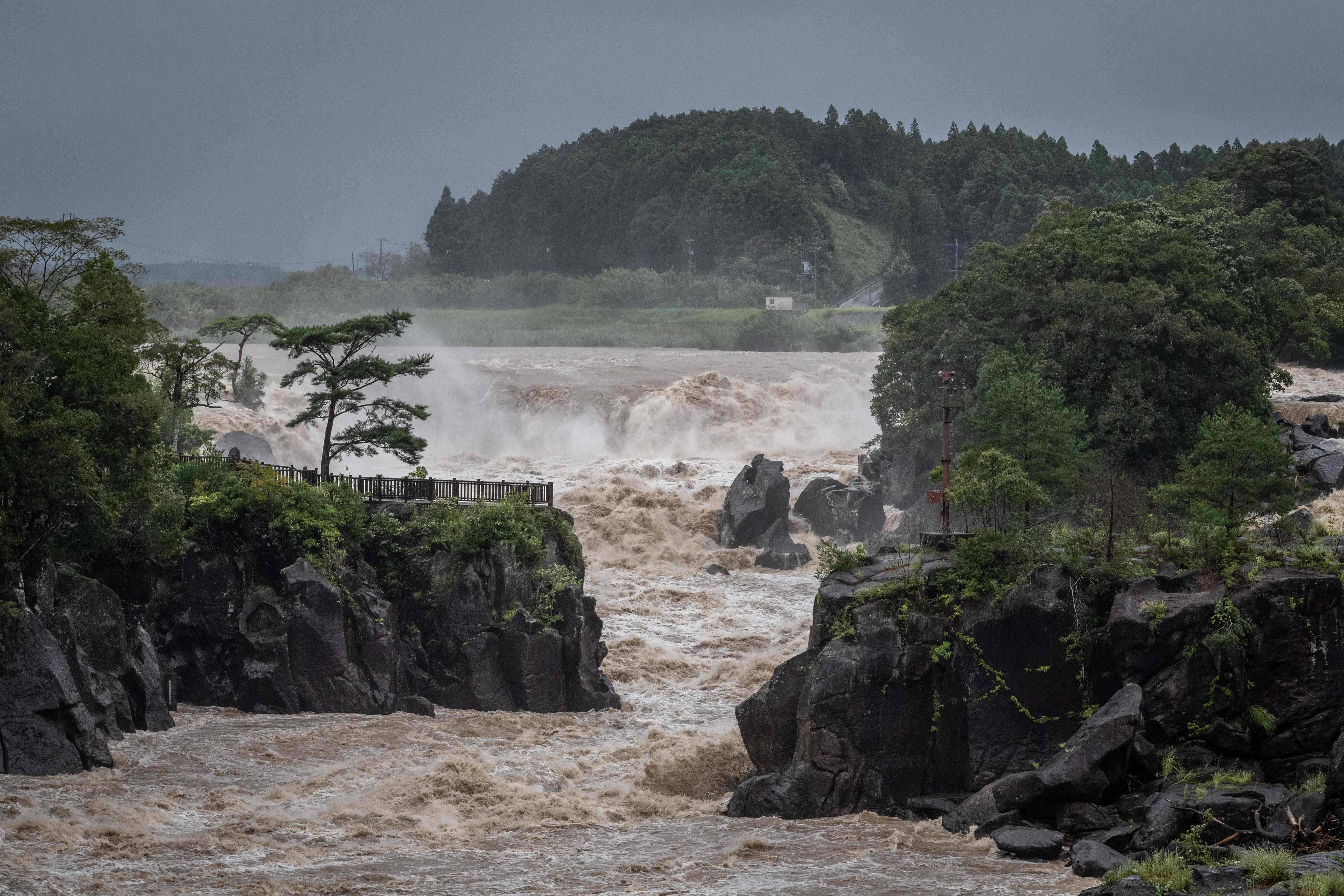 Raging waters flow along the Sendai River in the wake of Typhoon Nanmadol in Isa, Kagoshima prefecture on Monday