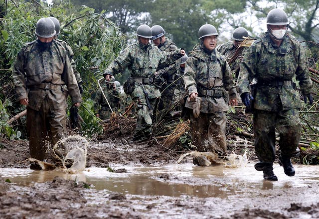 <p>File. Japanese Self-Defence Force [SDF] soldiers conduct search and rescue operation at a landslide site caused by Typhoon Nanmadol in Mimata Town, Miyazaki prefecture, Japan, 19 September 2022</p>