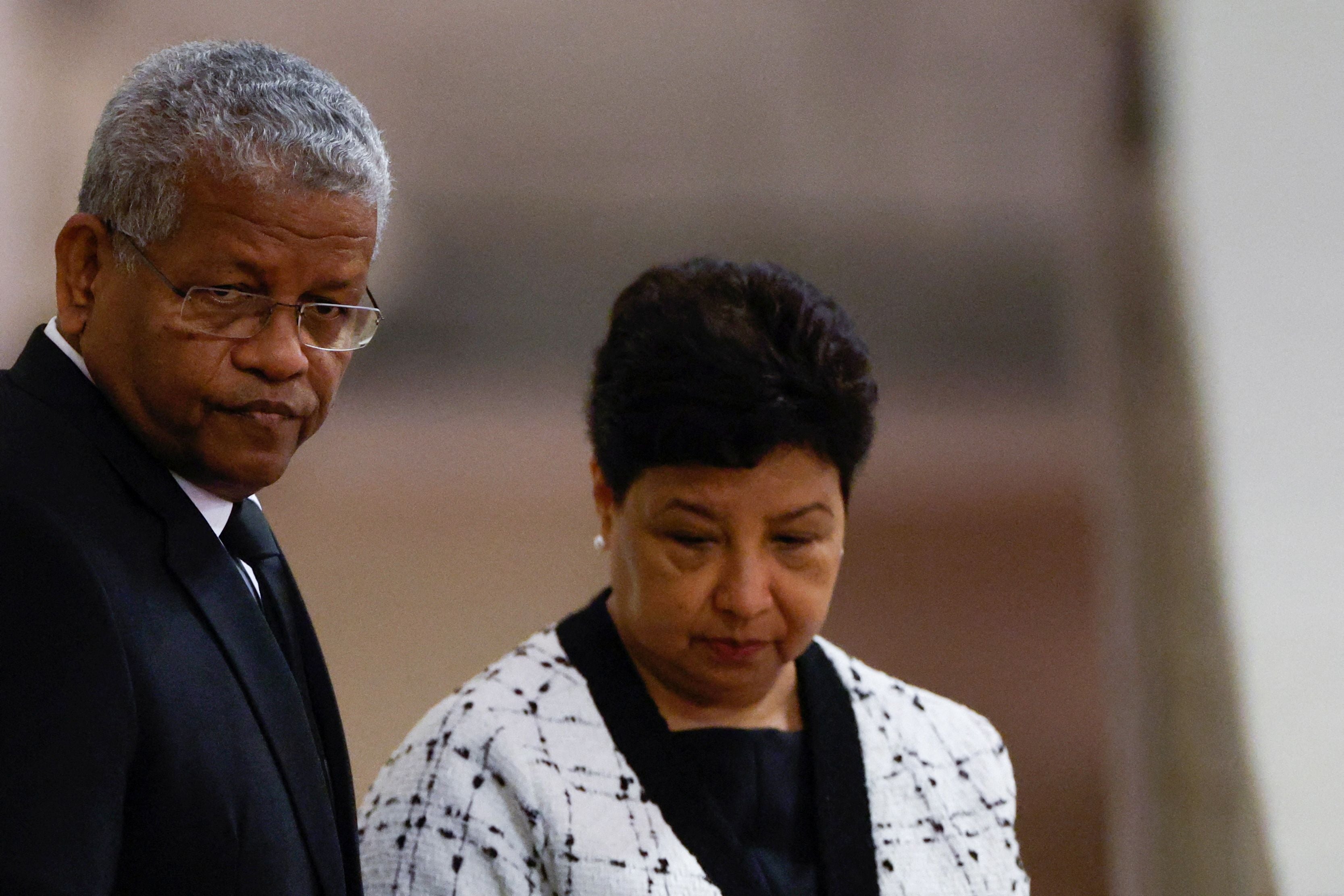 Seychelles President Wavel Ramkalawan (L) and his wife Linda Ramkalawan pay their respects to the Queen’s coffin