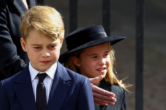 <p>The young prince and princess   seem perfectly equipped to cope with the austere ceremony </p>