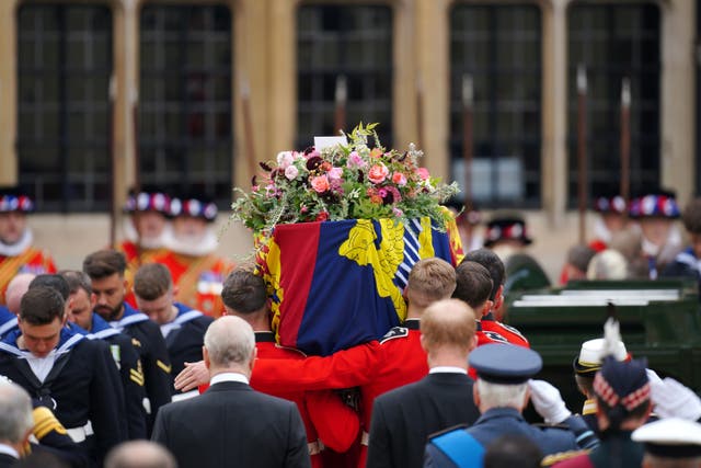 The coffin of Queen Elizabeth II being carried by pallbearers at the State Funeral held at Westminster Abbey, London. Picture date: Monday September 19, 2022.