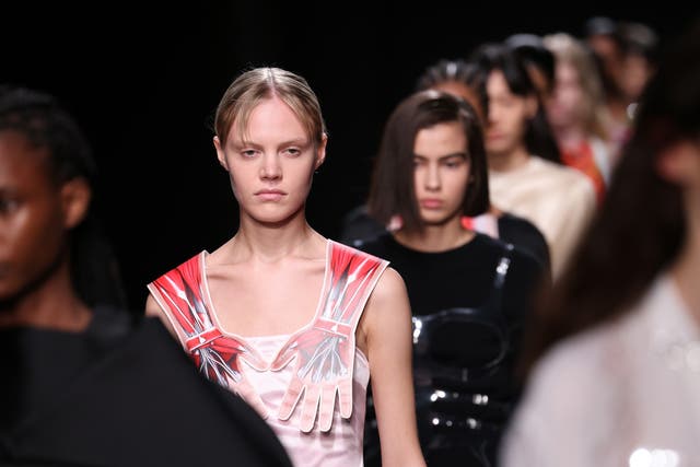 <p>Models walk the runway at the Christopher Kane show during London Fashion Week </p>