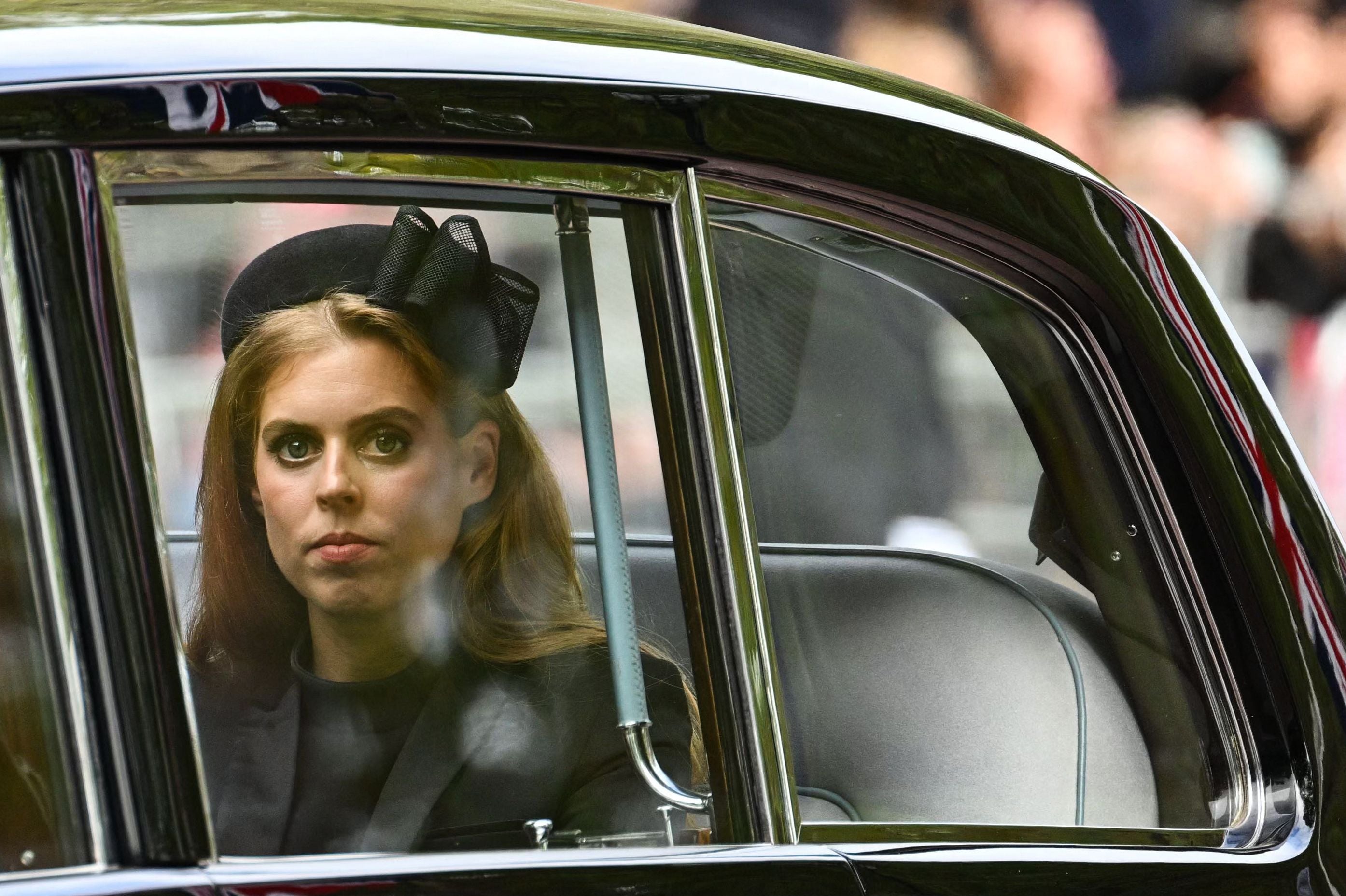 Princess Beatrice follows the funeral procession by car