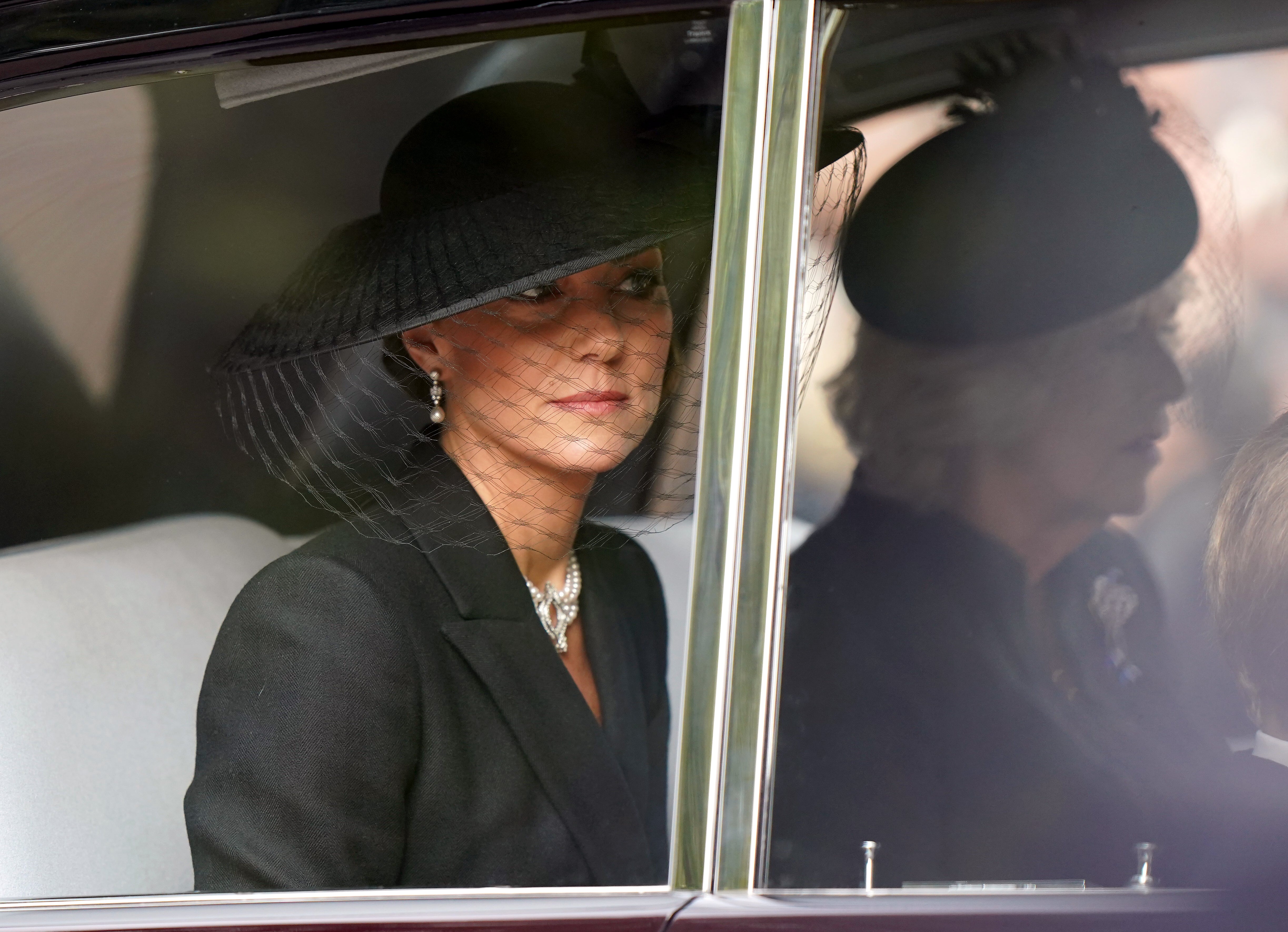 The Princess of Wales wore a black coat dress and pearl choker (Tim Goode/PA)