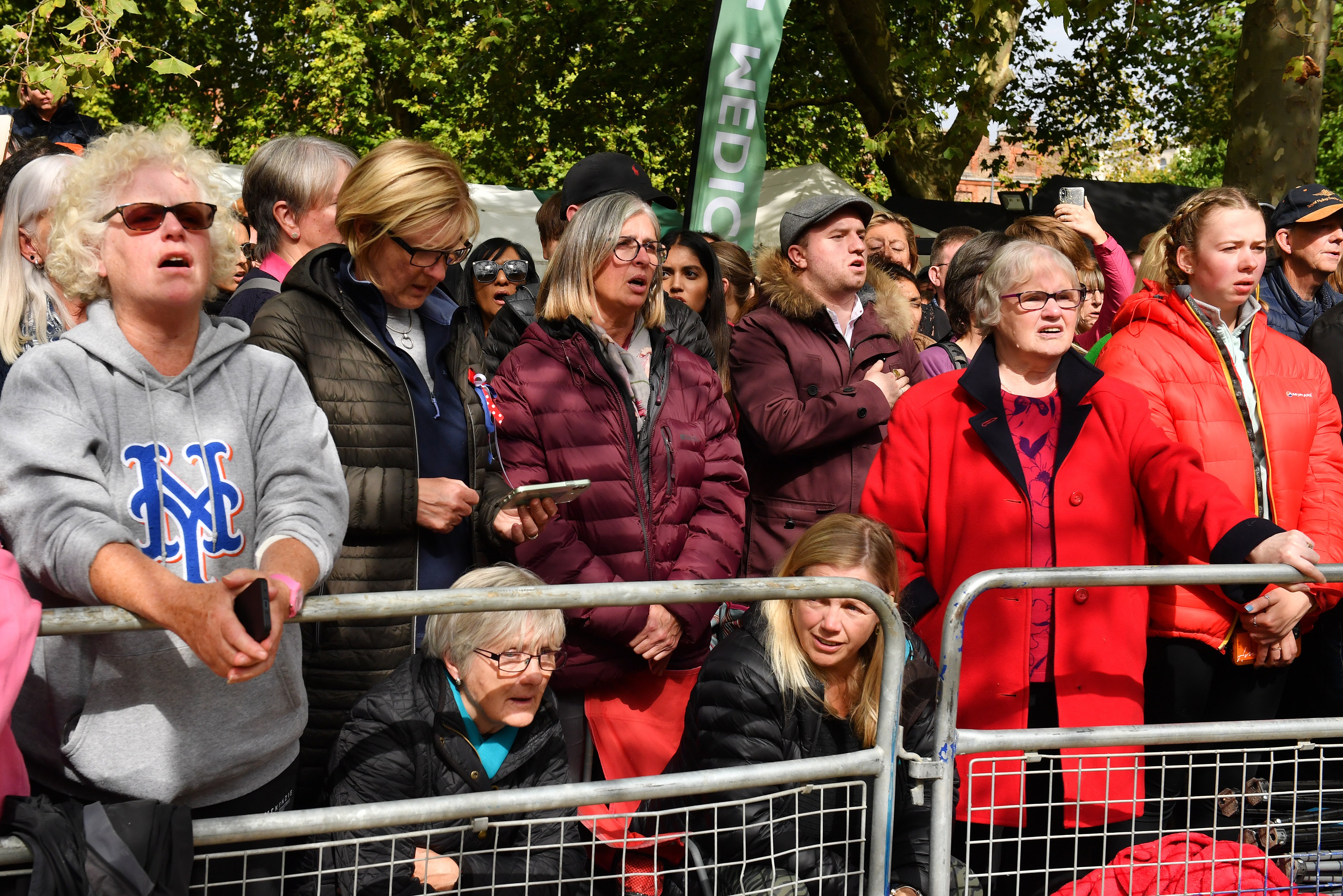 Members of the public on The Mall, central London, wait for the coffin procession after the state funeral (Anthony Devlin/PA)