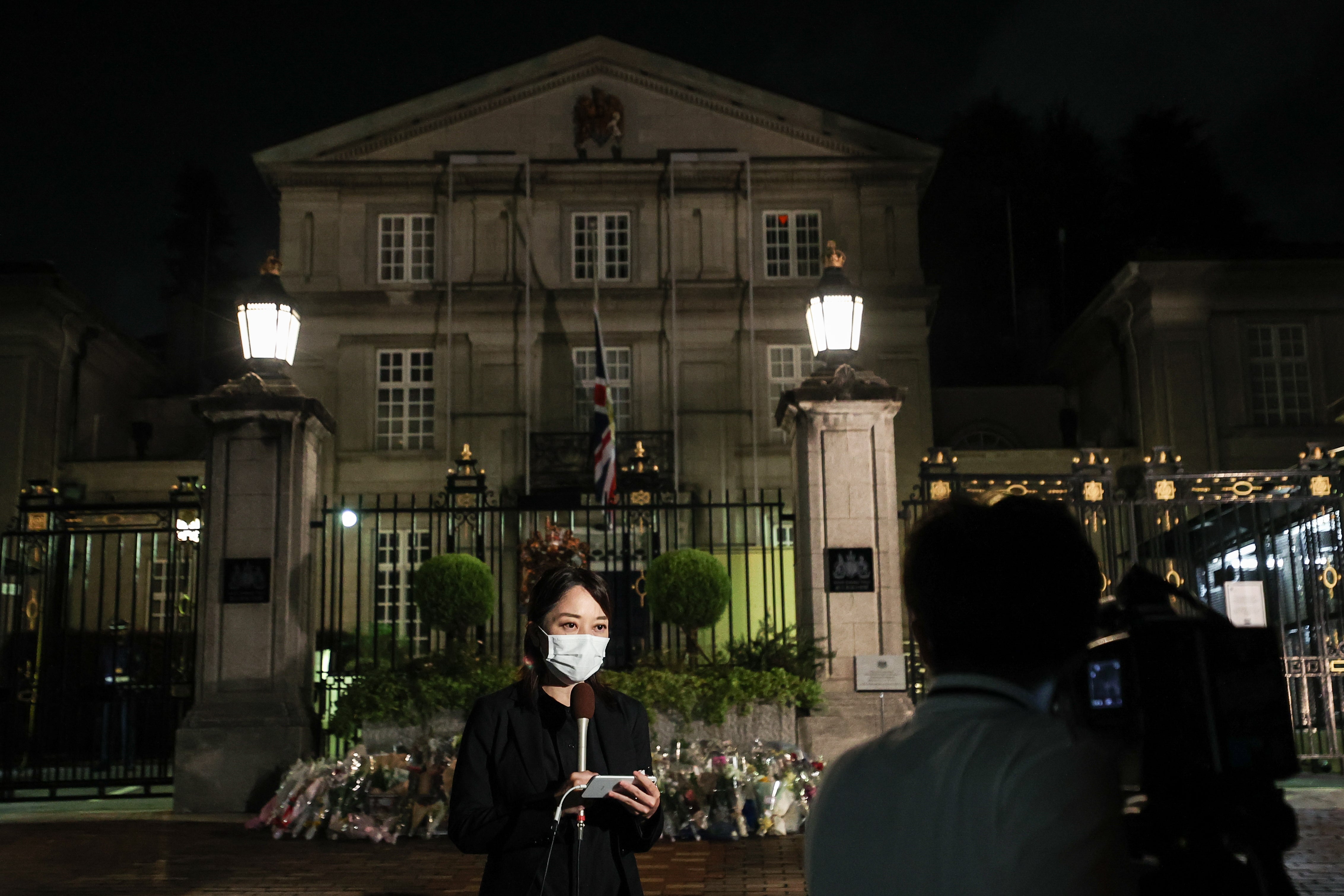 A journalist reports from the British Embassy on September 19, 2022 in Tokyo, Japan