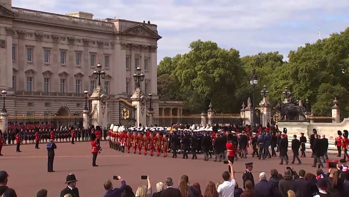 Queen passes Buckingham Palace for final time as funeral procession marches through London