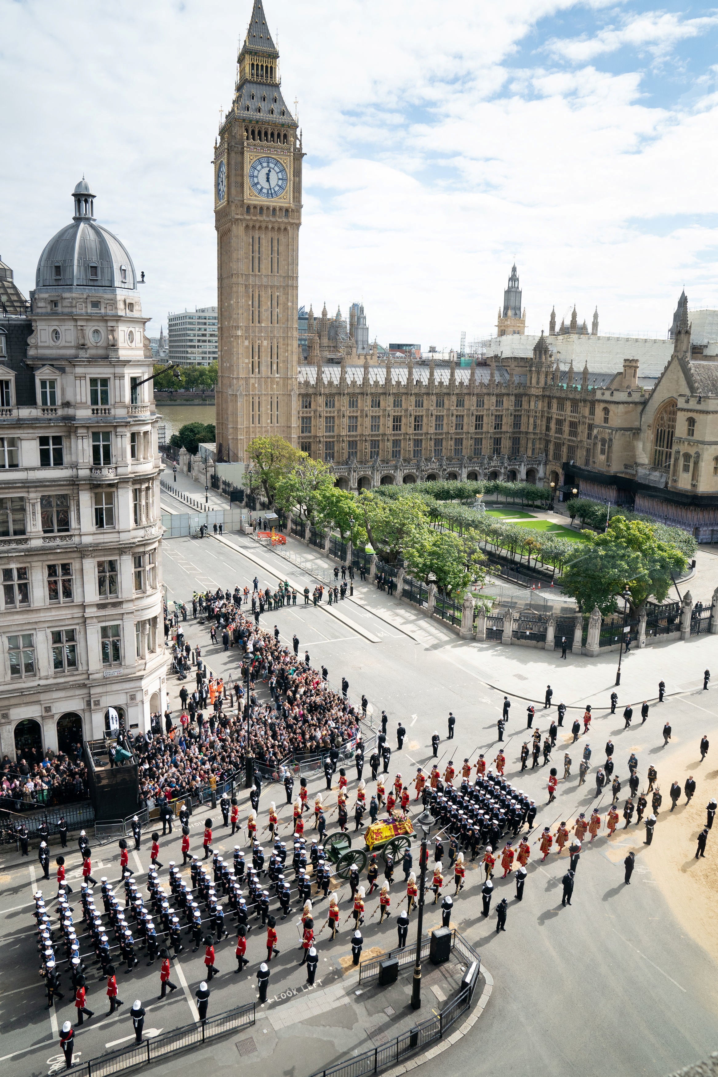 The Queen’s coffin passes the Houses of Parliament after leaving Westminster Abbey