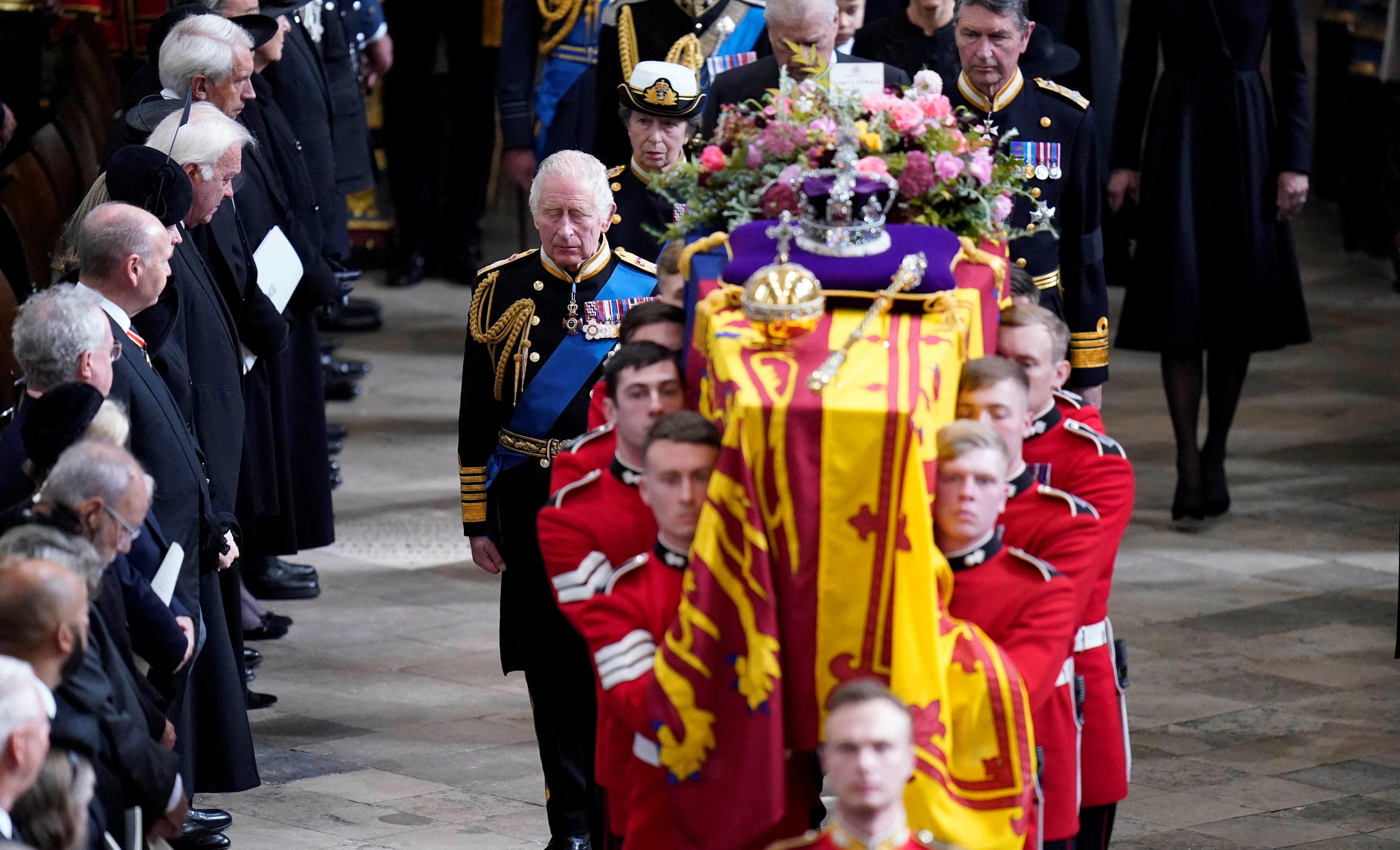 The coffin of Queen Elizabeth II is carried out of Westminster Abbey on Monday