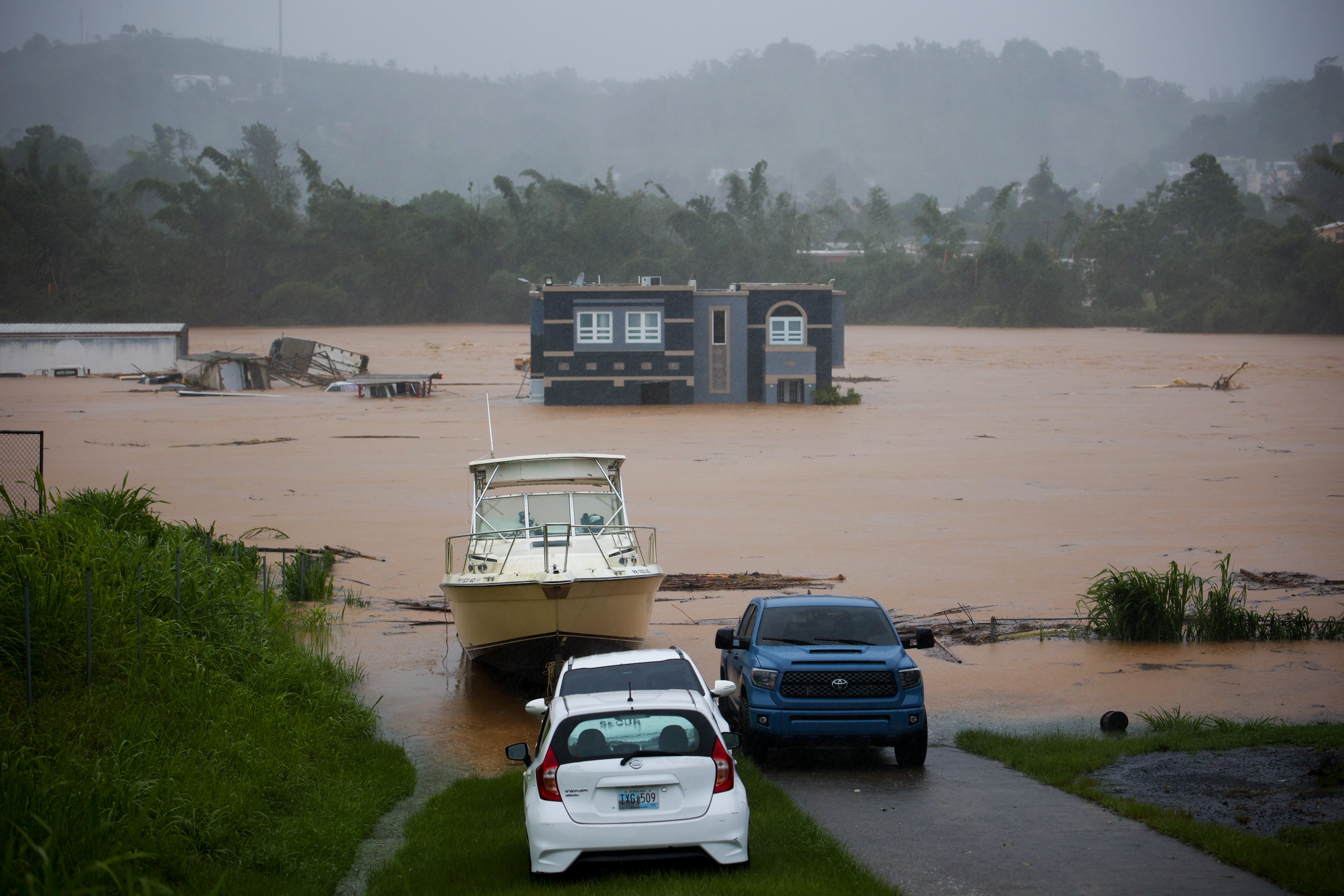 A homes sits submerged after devastating rain hit Cayey, Puerto Rico during Hurricane Fiona