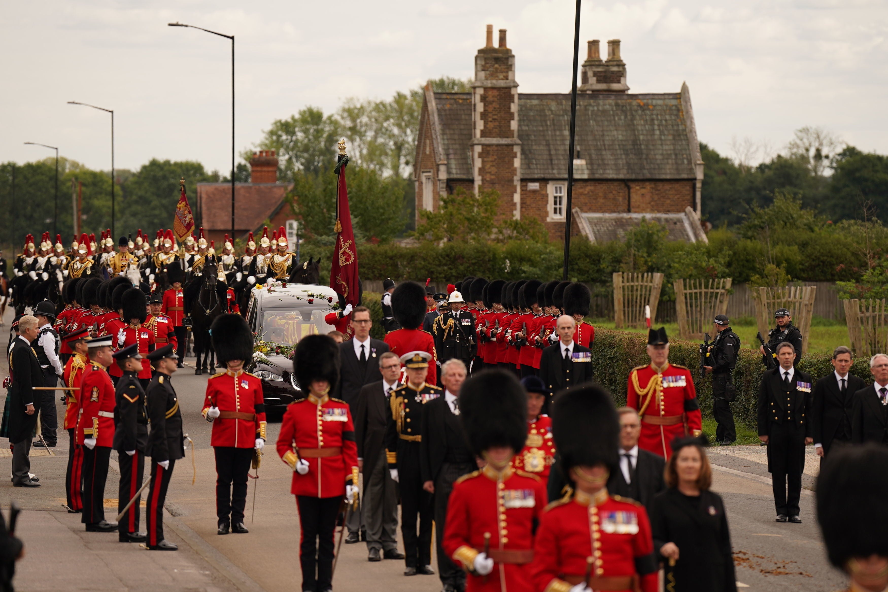 A procession joins the hearse on the final part of the Queen’s journey to Windsor Castle