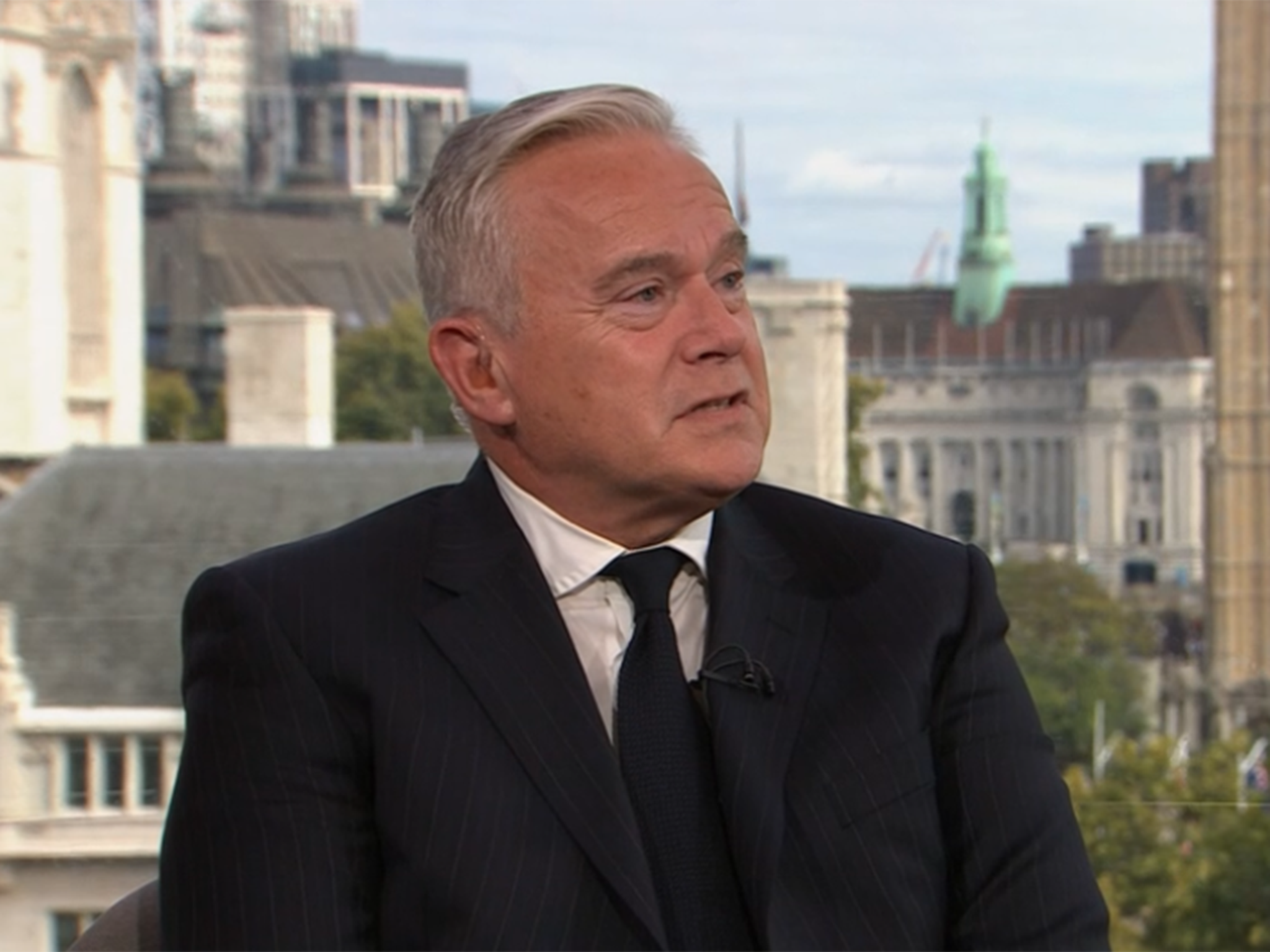 Huw Edwards against the backdrop of Westminster Abbey