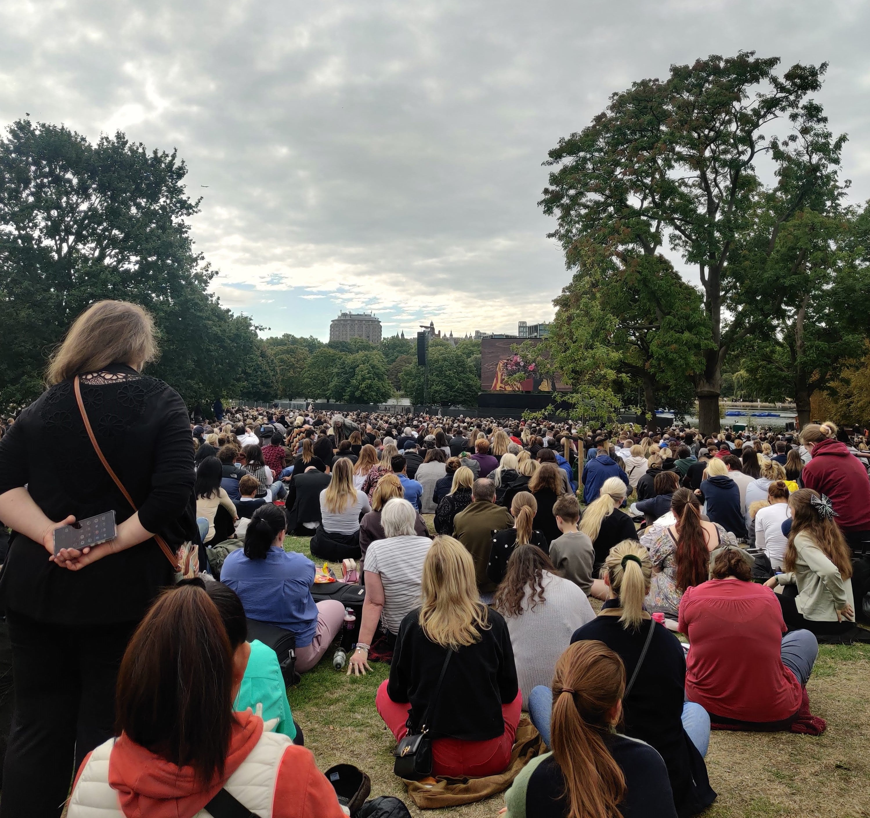 Thousands sit and watch the Queen’s funeral at Hyde Park