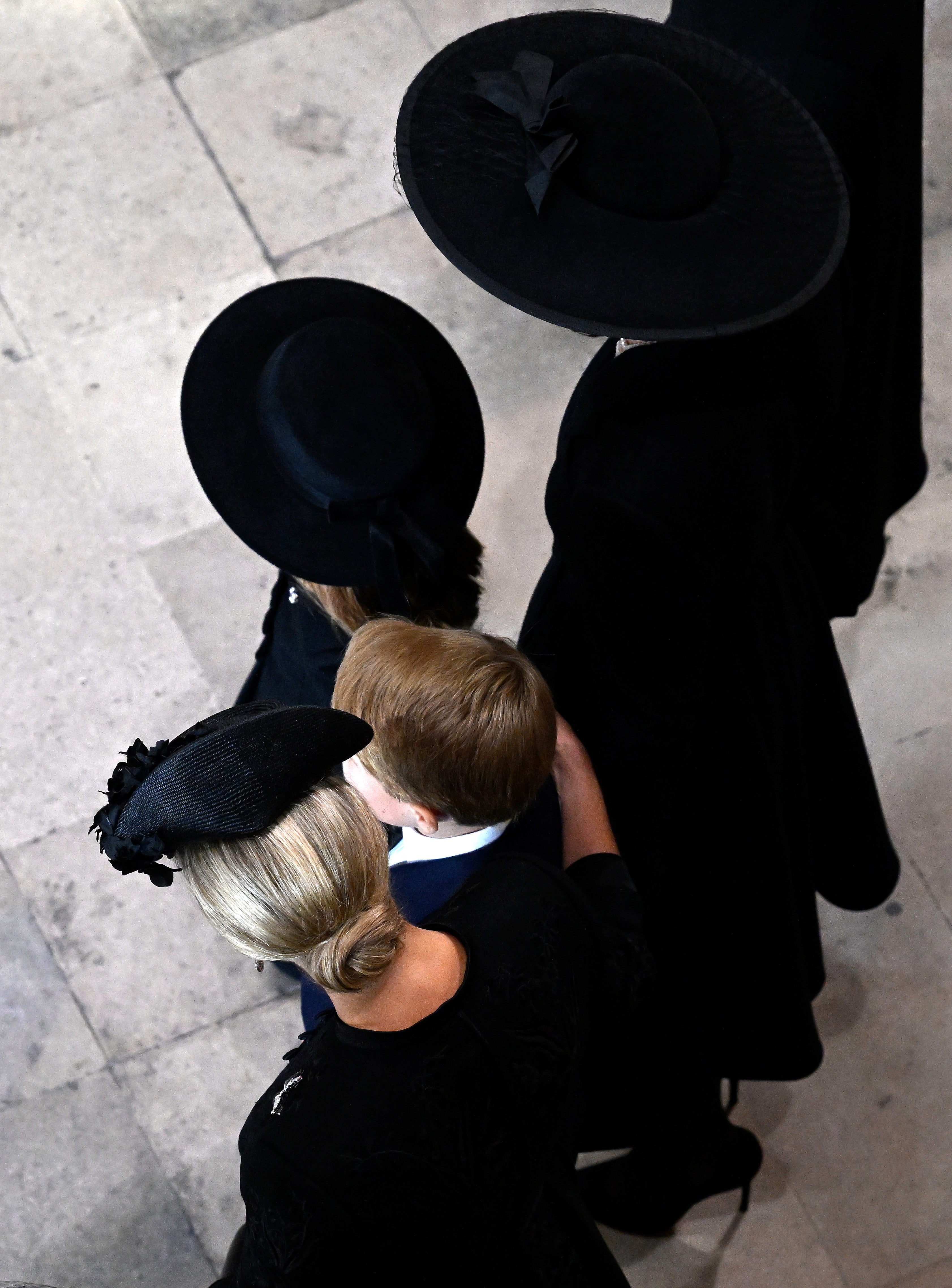 Sophie, Countess of Wessex comforts Prince George after funeral