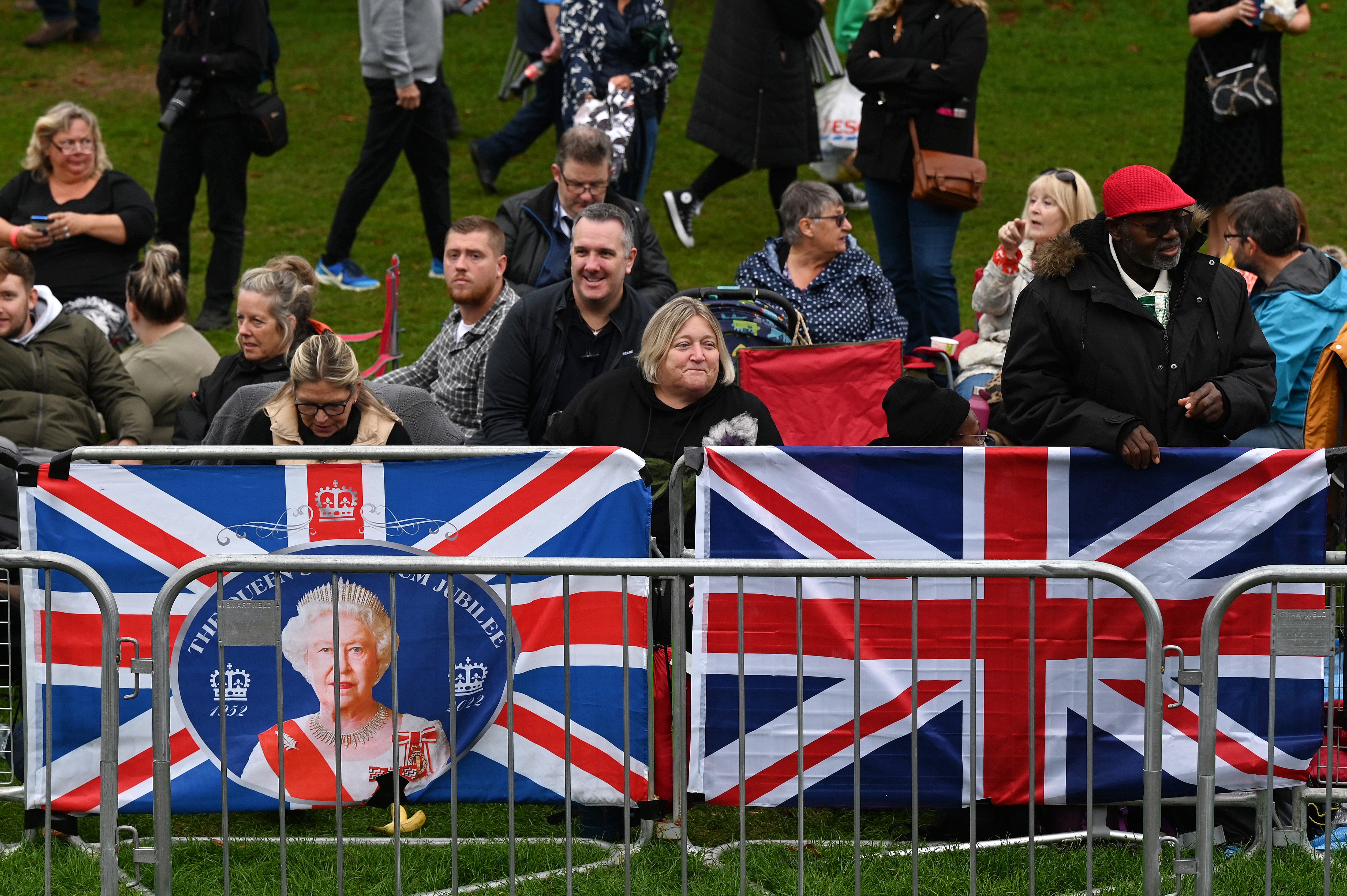 Members of the public line the route in Windsor ahead of the procession for the coffin of the Queen (Stuart C Wilson/PA)