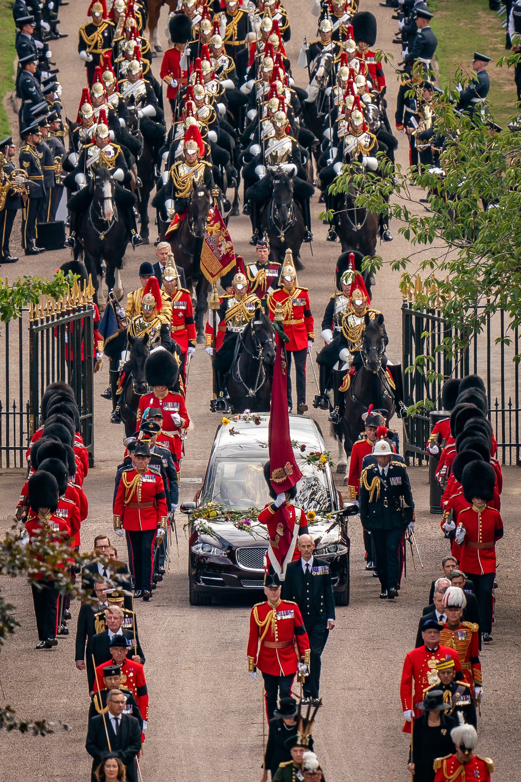 The Ceremonial Procession of the coffin of Queen Elizabeth passes through gates on the Long Walk as it arrives at Windsor Castle for the Committal Service at St George’s Chapel (Aaron Chown/PA)