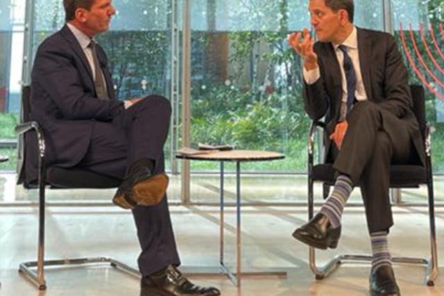 <p>David Miliband, right, executive Director of the International Rescue Committee, speaks with CNN’s Bill Weir during the opening ceremony of New York Climate Week</p>
