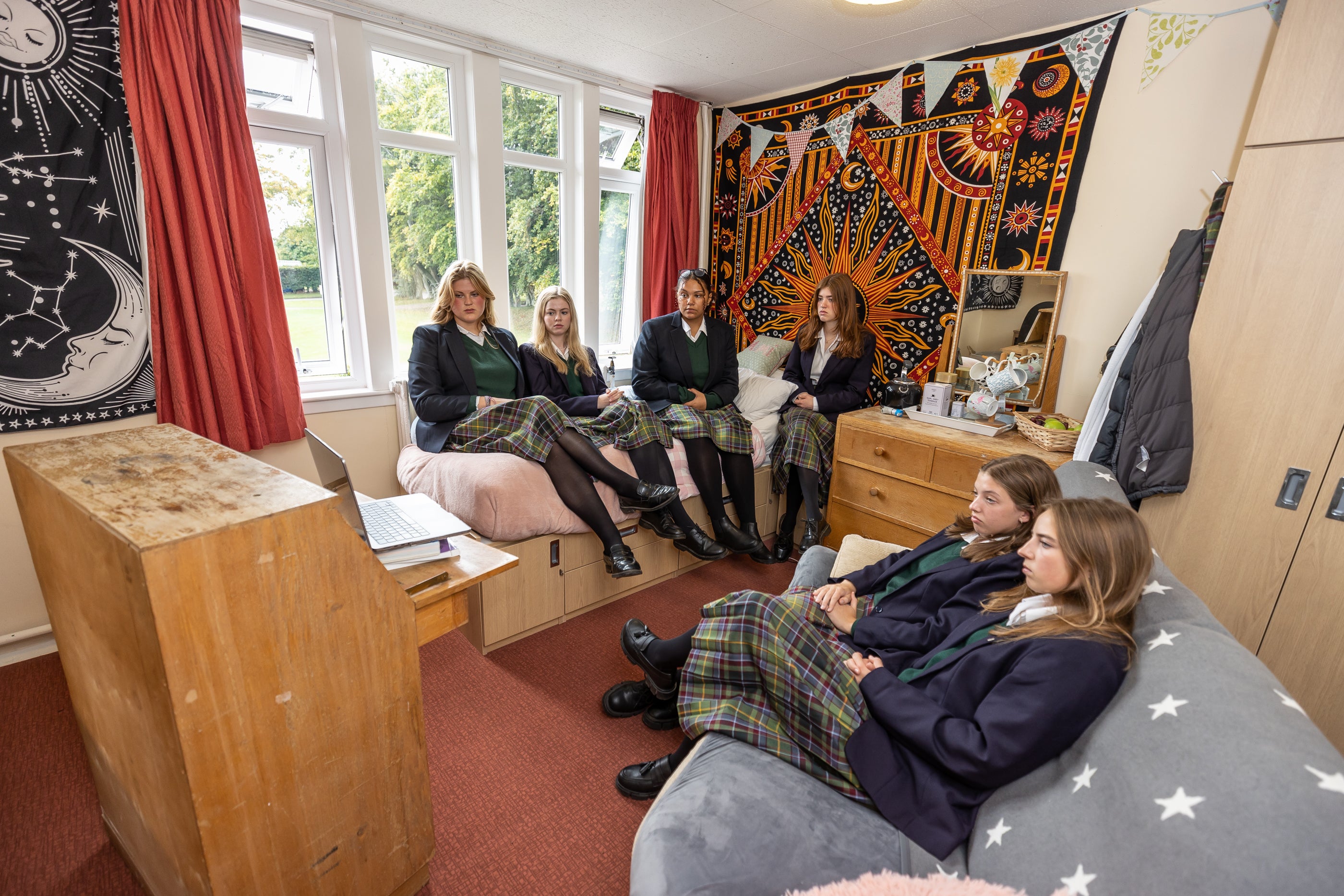 Students watch the funeral in their boarding house, Windmill Lodge, at Gordonstoun (Paul Campbell/PA)