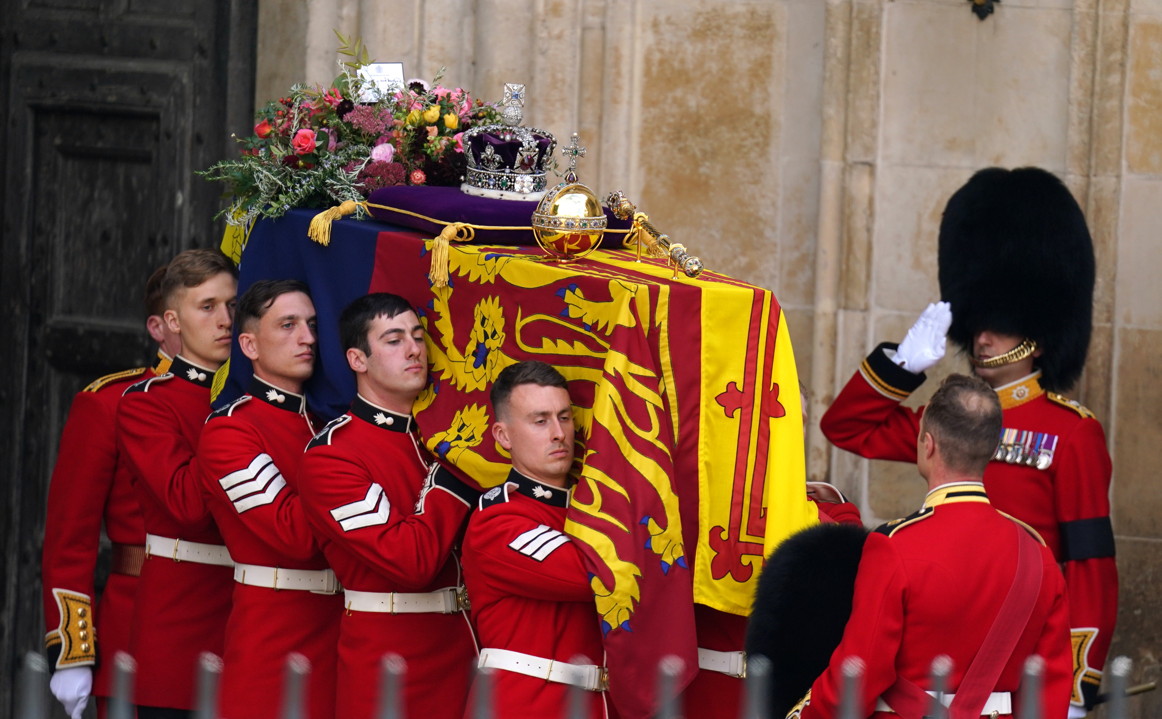 The Queen’s coffin leaves Westminster Abbey after the service (Andrew Milligan/PA)