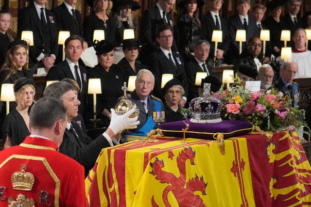 The Orb and Sceptre are removed from the coffin at the Committal Service for Queen Elizabeth II, held at St George’s Chapel in Windsor Castle, Berkshire. Picture date: Monday September 19, 2022.