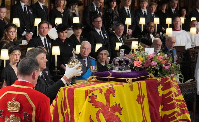 The Orb and Sceptre are removed from the coffin at the Committal Service for Queen Elizabeth II, held at St George’s Chapel in Windsor Castle, Berkshire. Picture date: Monday September 19, 2022.