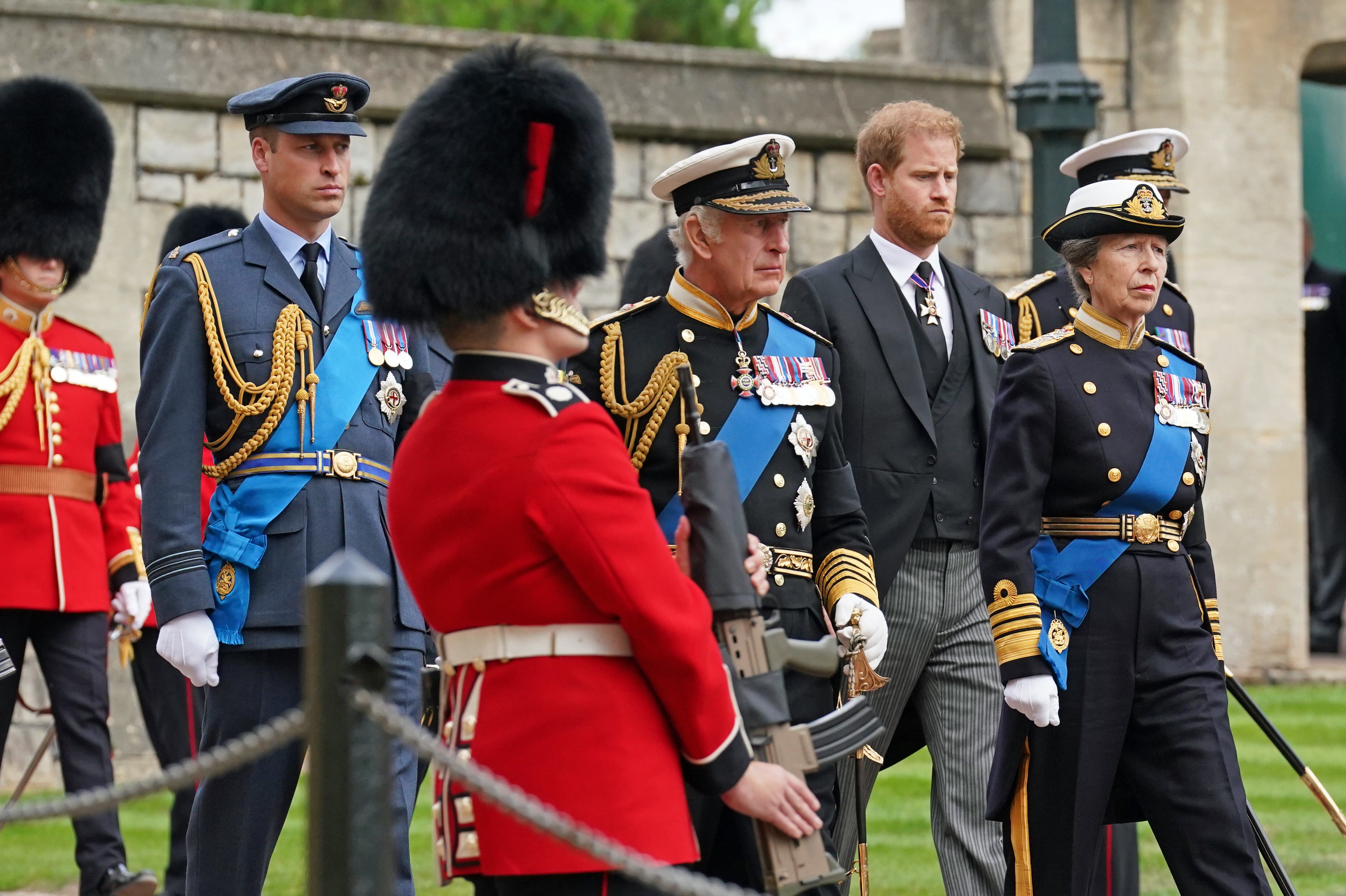 The Prince of Wales and the Duke of Sussex follow their father and the Princess Royal behind the hearse as it arrives at St George’s Chapel in Windsor Castle (Kirsty O’Connor/PA)