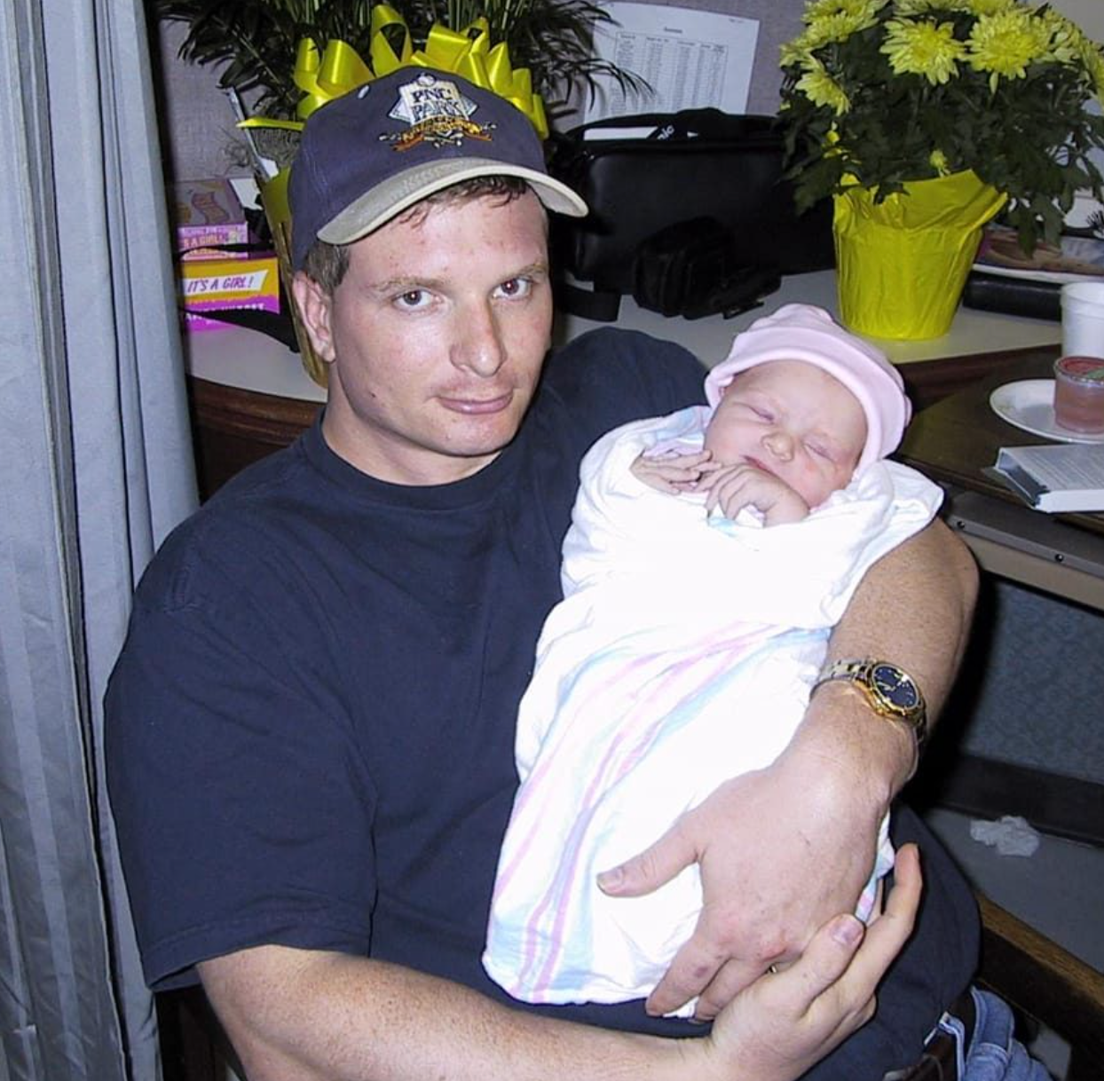 Mr Rice holds baby Allison in his arms