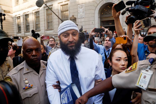 <p>Adnan Syed walks out of court on Monday after a judge threw out his conviction </p>
